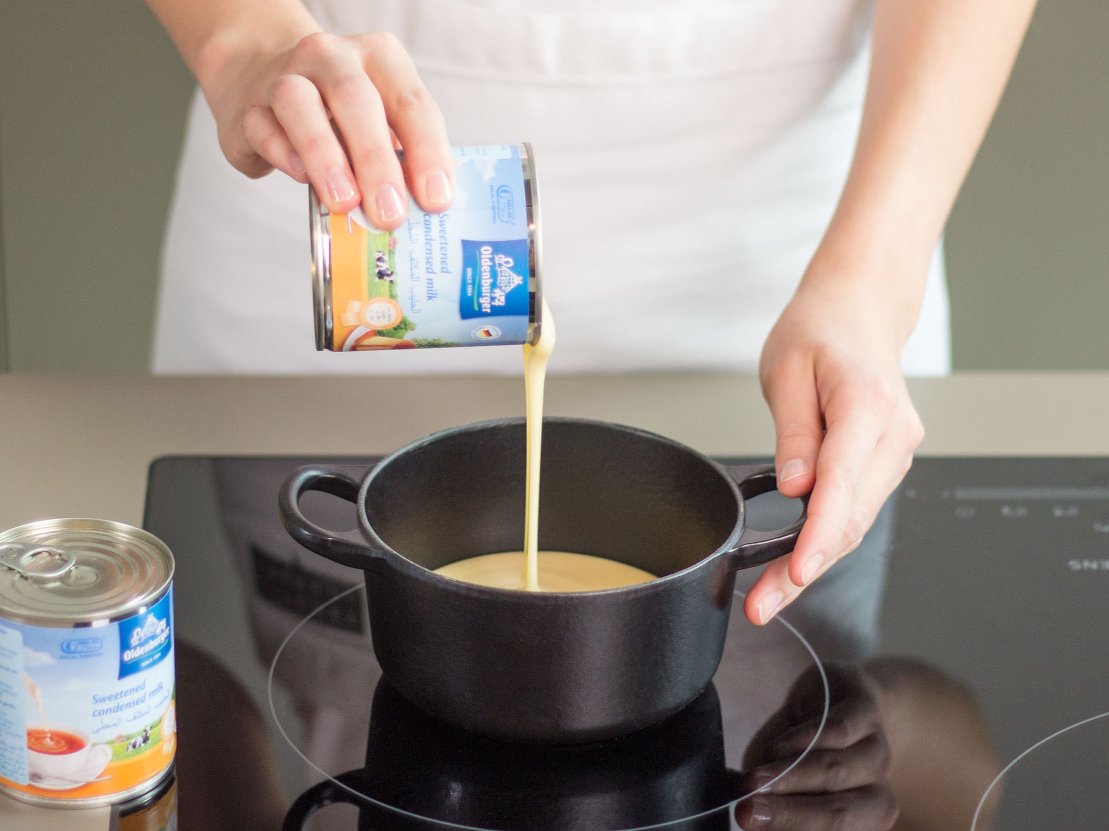 In a small saucepan, heat up condensed milk over medium heat and cook for approx. 3 – 5 min.