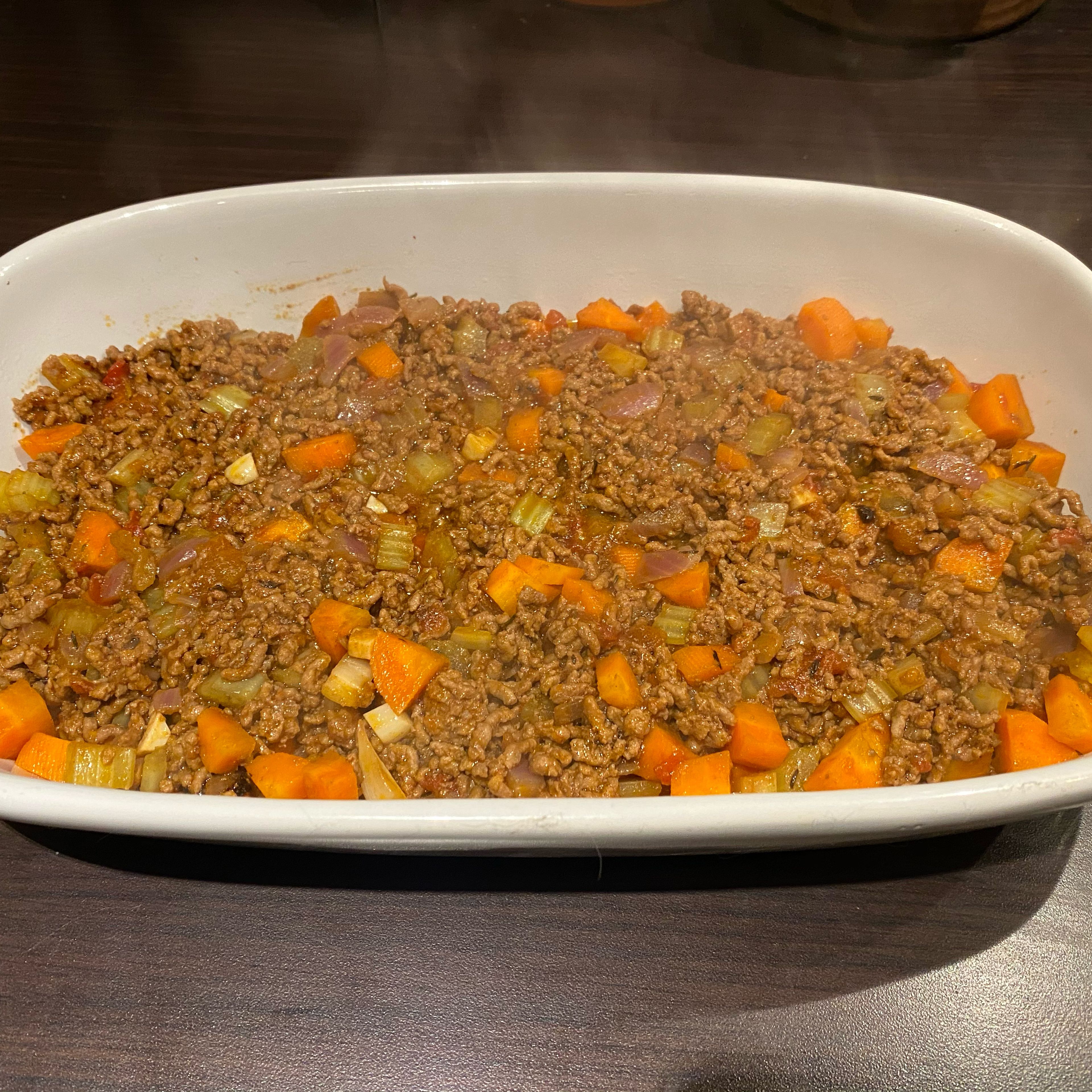 Spread beef mix in the bottom of an oven proof dish.