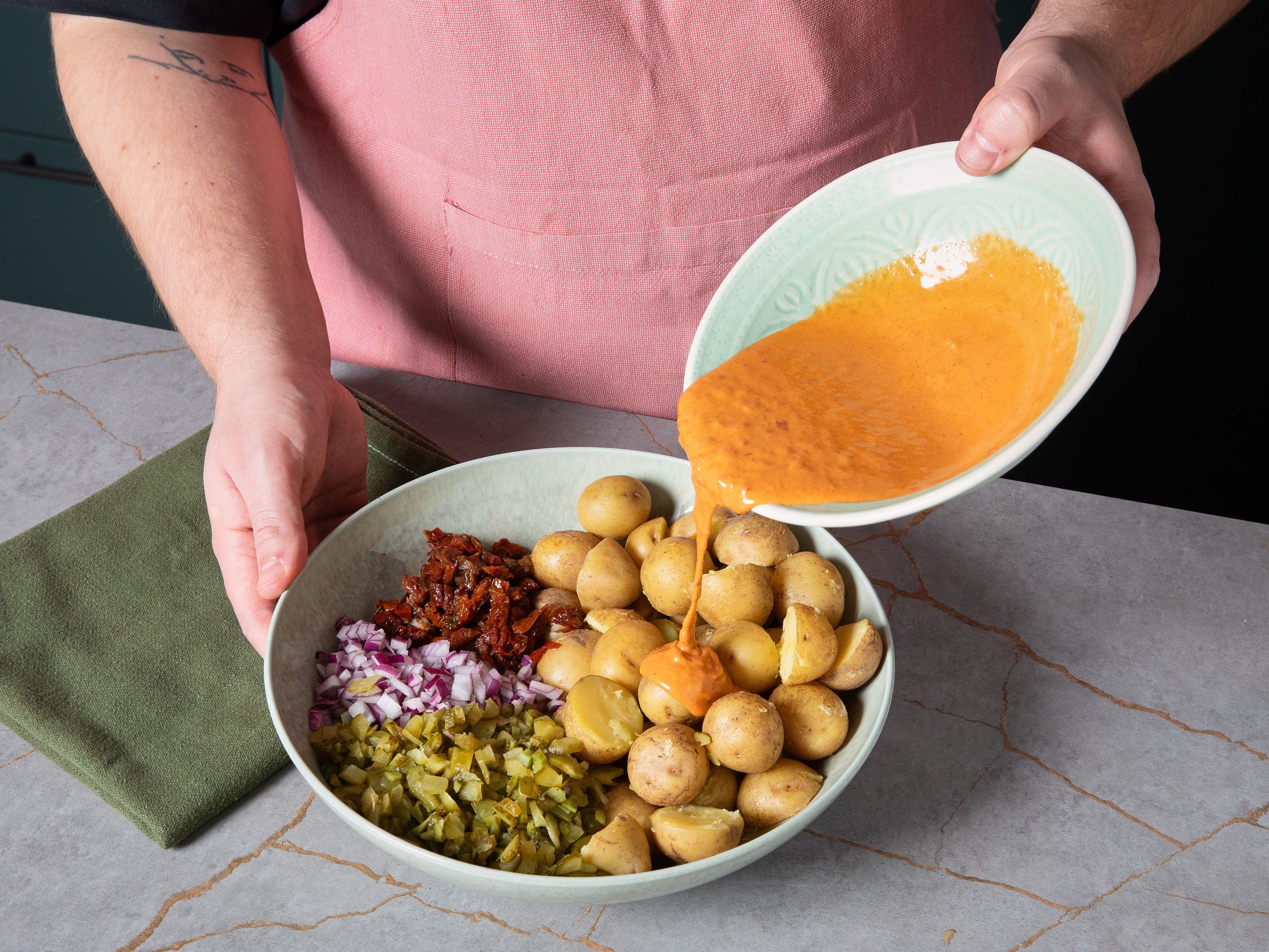 In a large bowl, mix all ingredients except chives and pine nuts. Add dressing in, fold it in and season to taste with salt and pepper. Garnish with chives and pine nuts to serve.