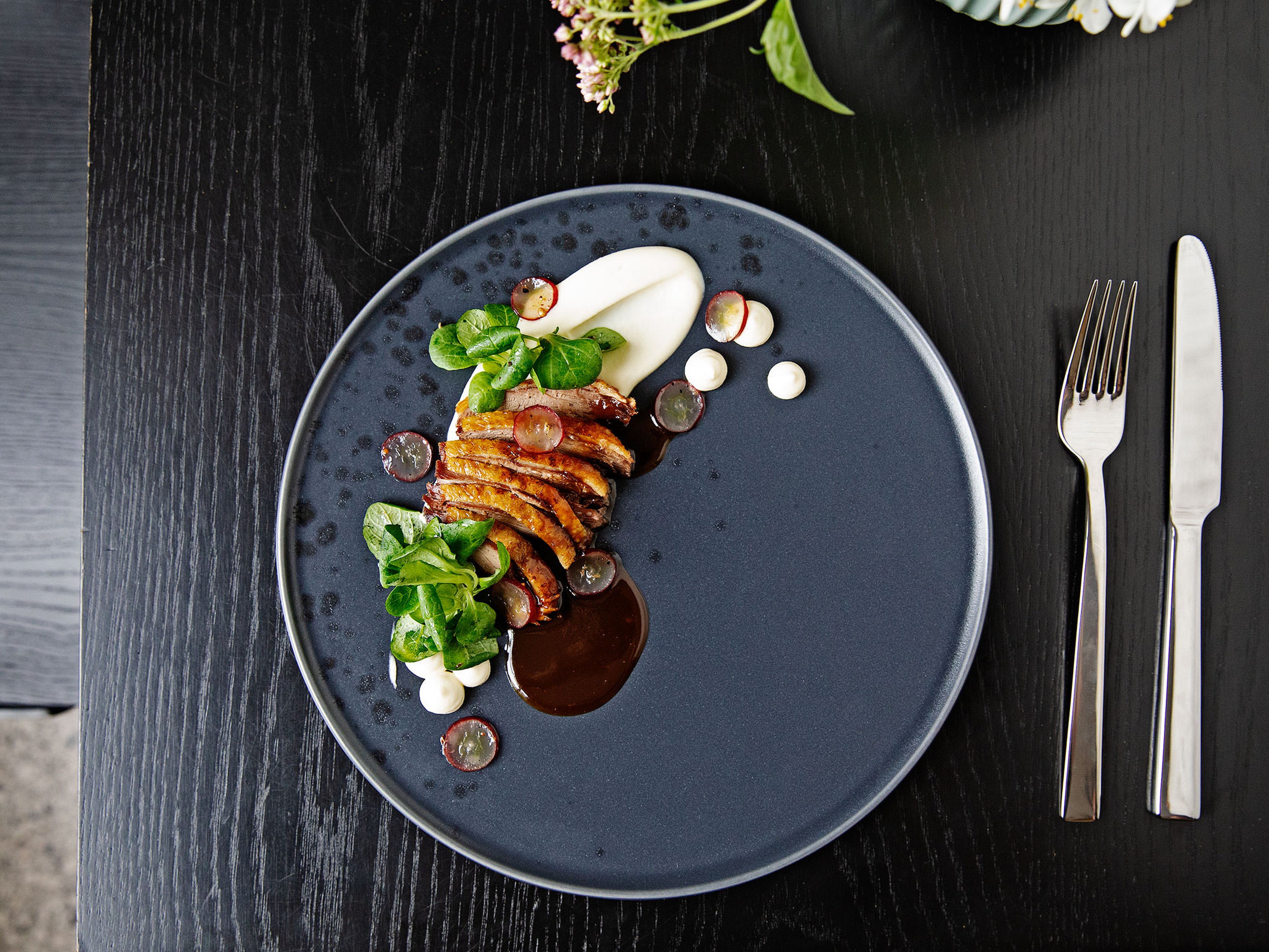 Crispy duck with celery root purée and grape salad