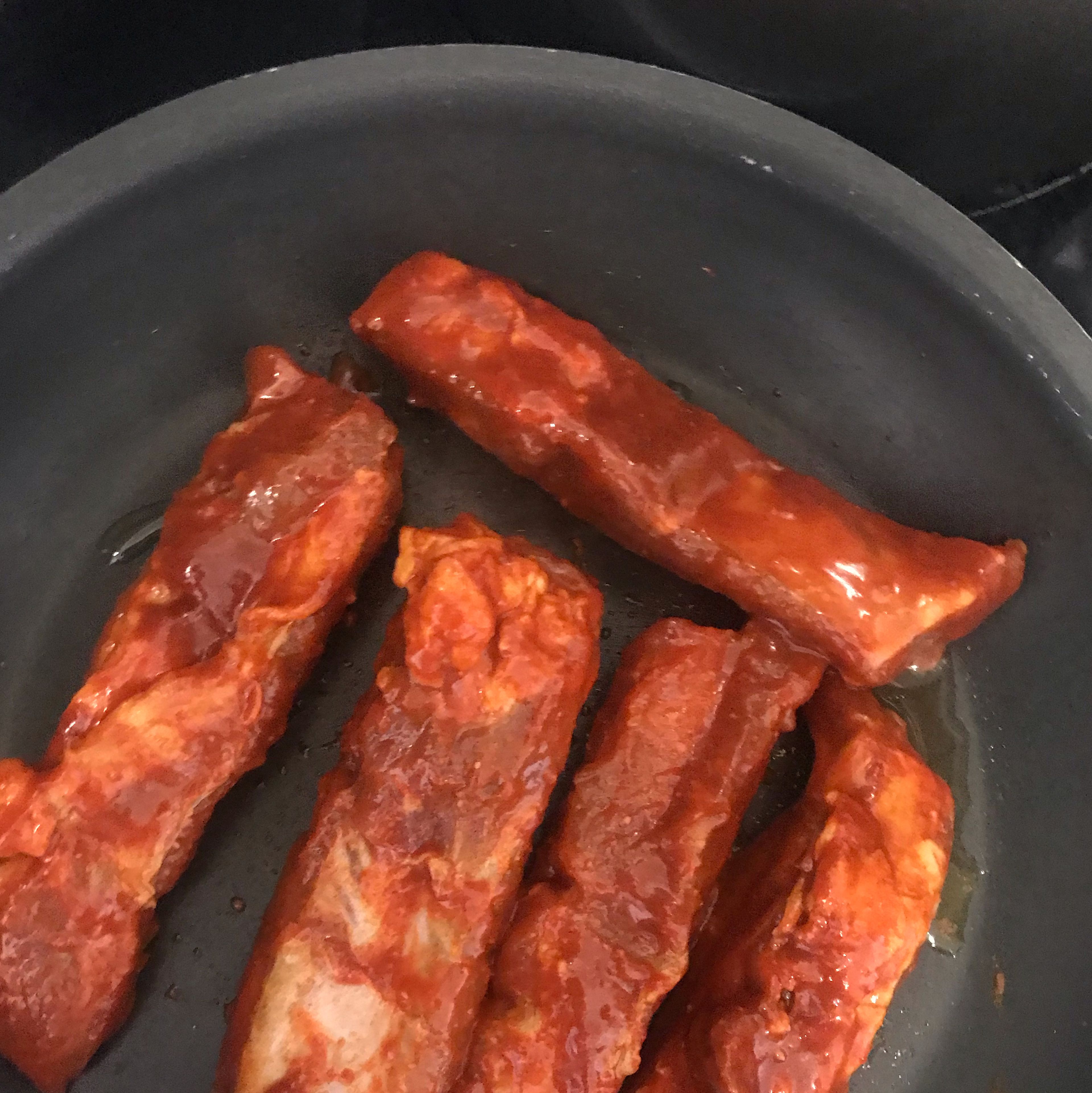 Add some oil in the pan and cook through the pork ribs. Then wipe the excess oil