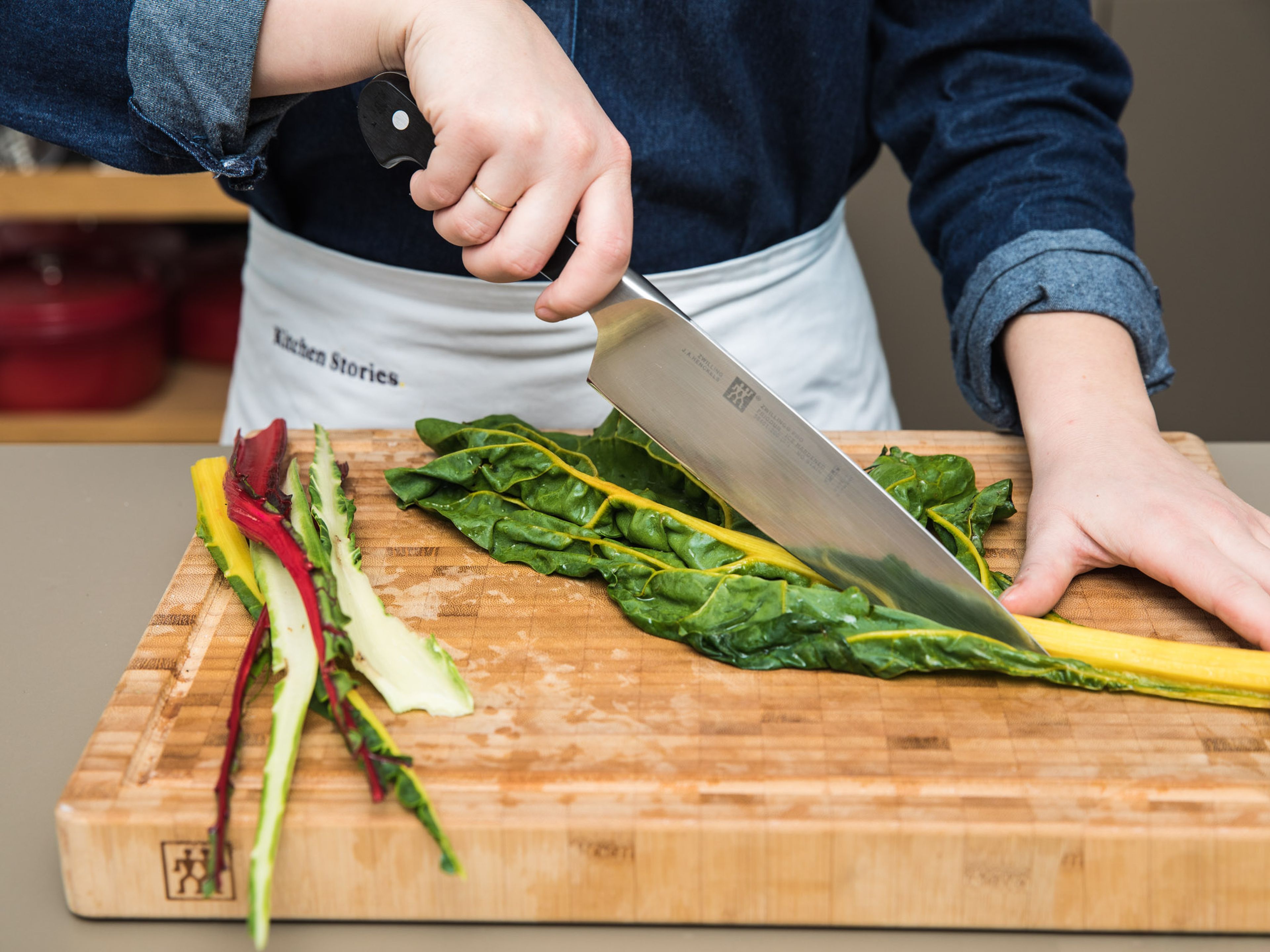 Wash Swiss chard, slice the leaves from the stems, and tear them into pieces. Finely slice stems. Peel and finely dice shallots and garlic. Zest and juice lemon. Set everything aside.