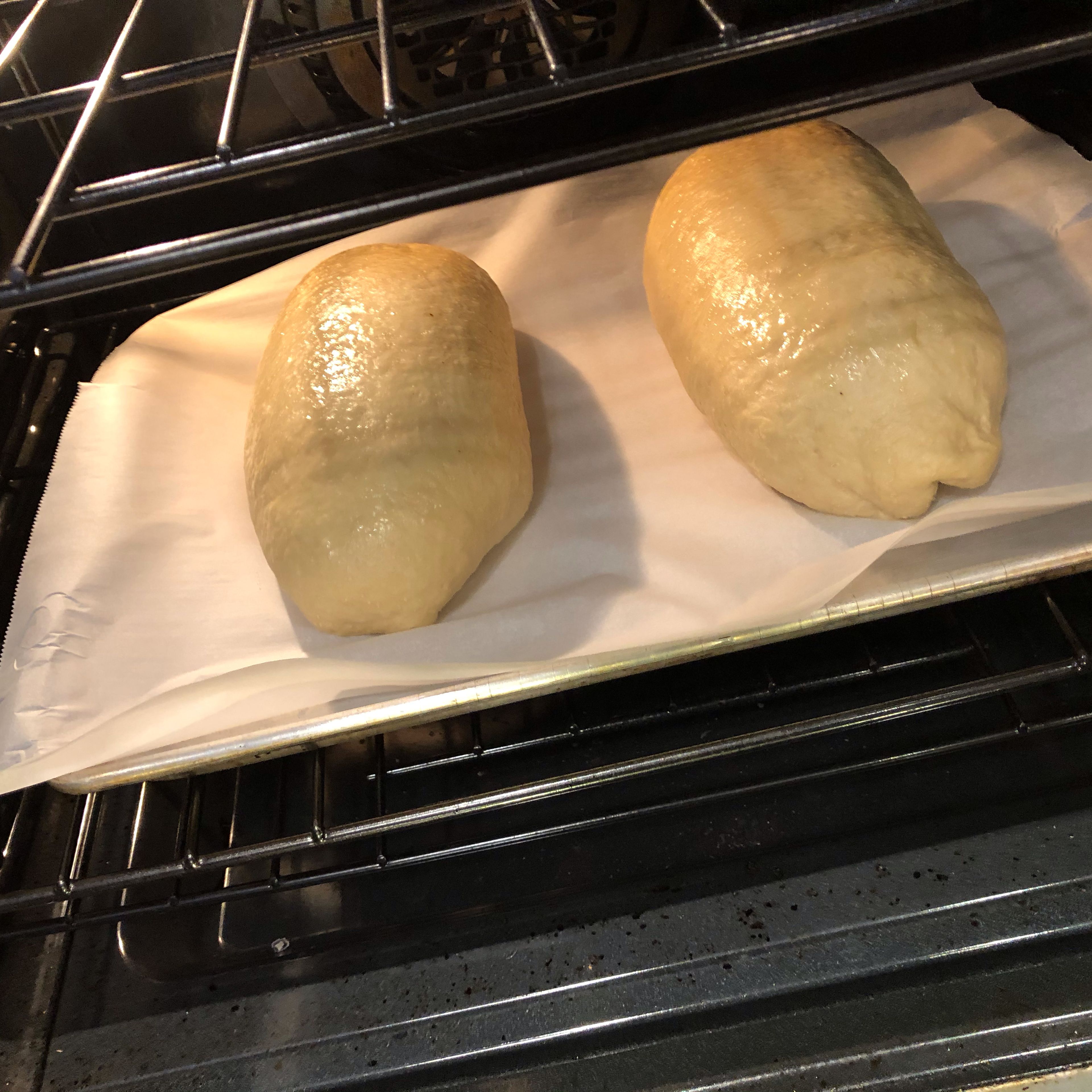 Preheat oven to 410 F. When loaves are fully risen, place baking sheets in oven and bake for 20 - 35 minutes (depending on the size of the loaf) or until internal temperature of the loaf reaches 195 F. If testing bread temperature, insert probe into loaf in an area where there is only dough and not the almond paste. The paste will not reach that temperature.