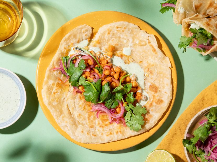 Paratha wraps with chickpeas, pickled onions and raita