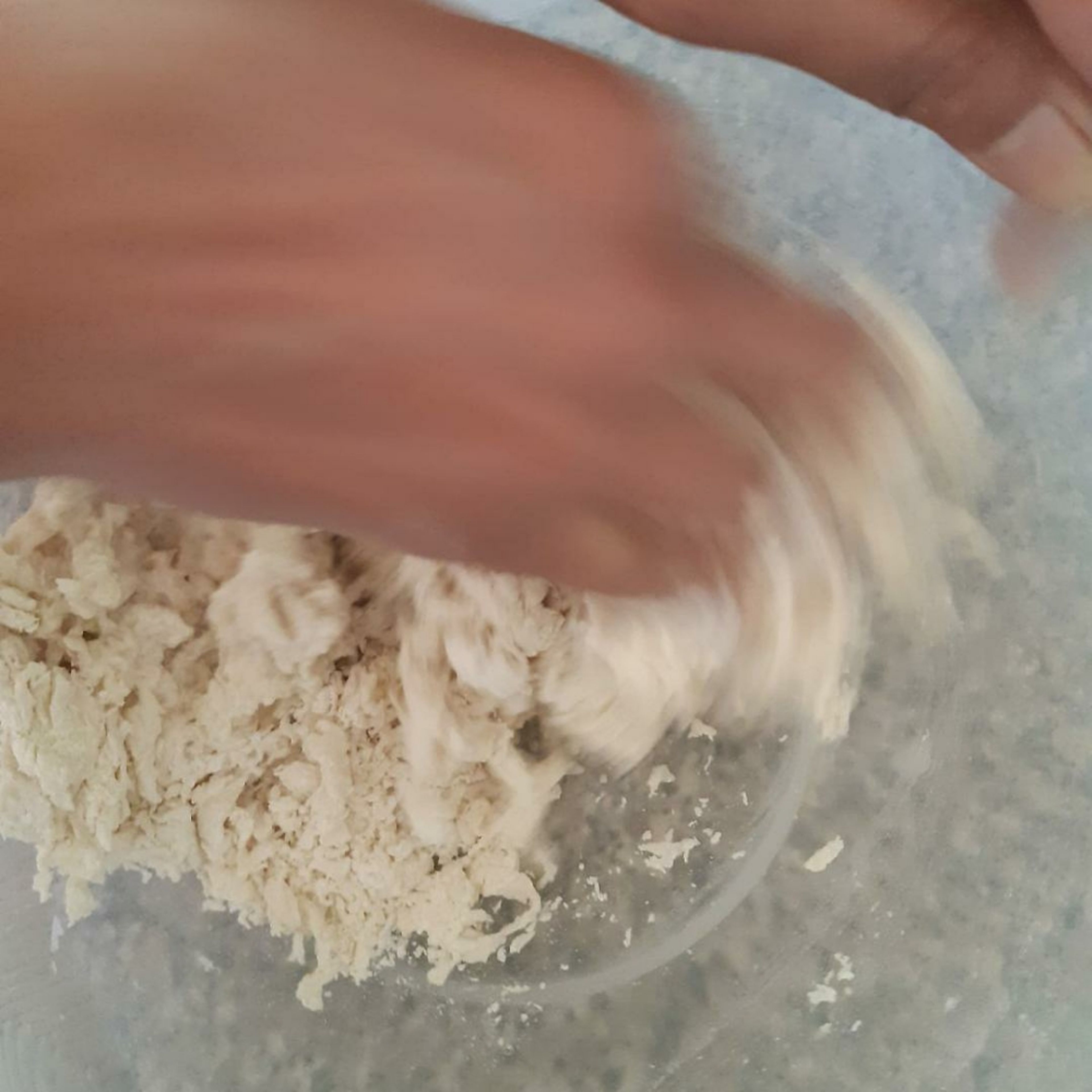 Add water little by little to the flour, making a stiff dough.