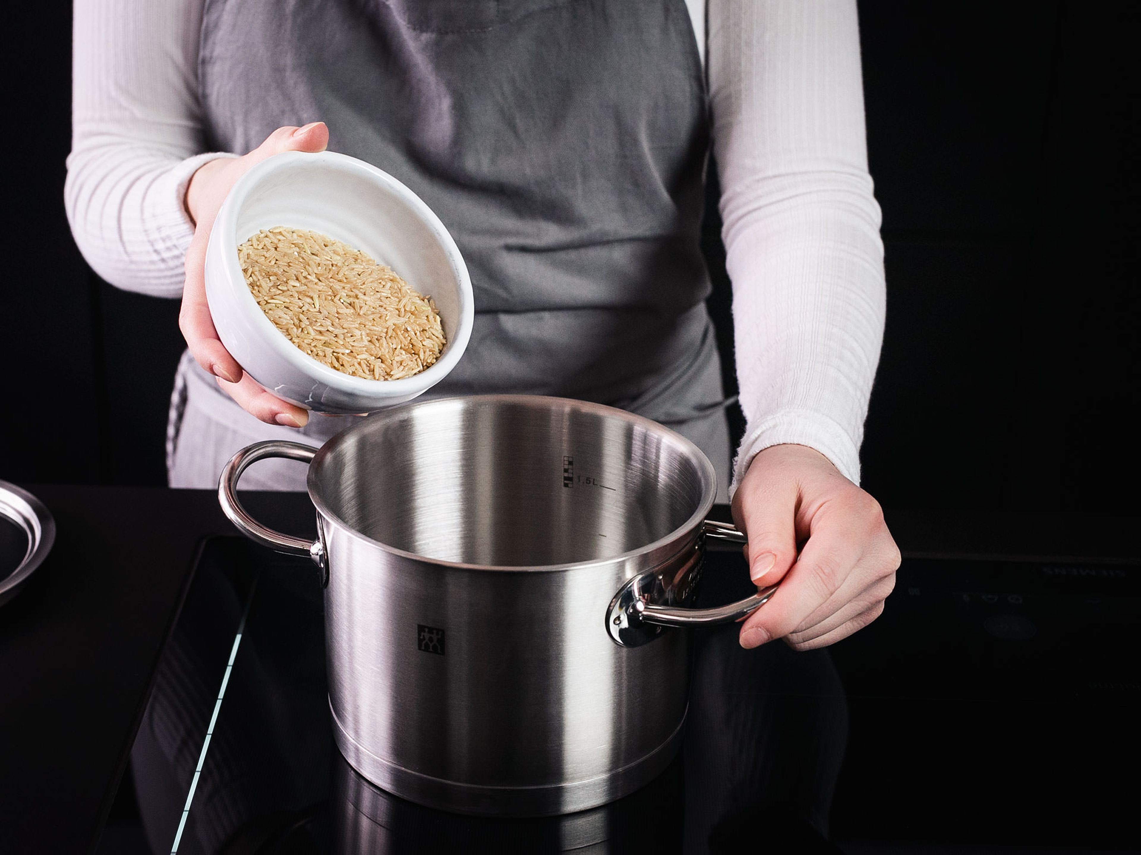 Add water and rice to a small pot. Bring to a boil, then cover, reduce heat to low, and let cook for approx. 15 min.