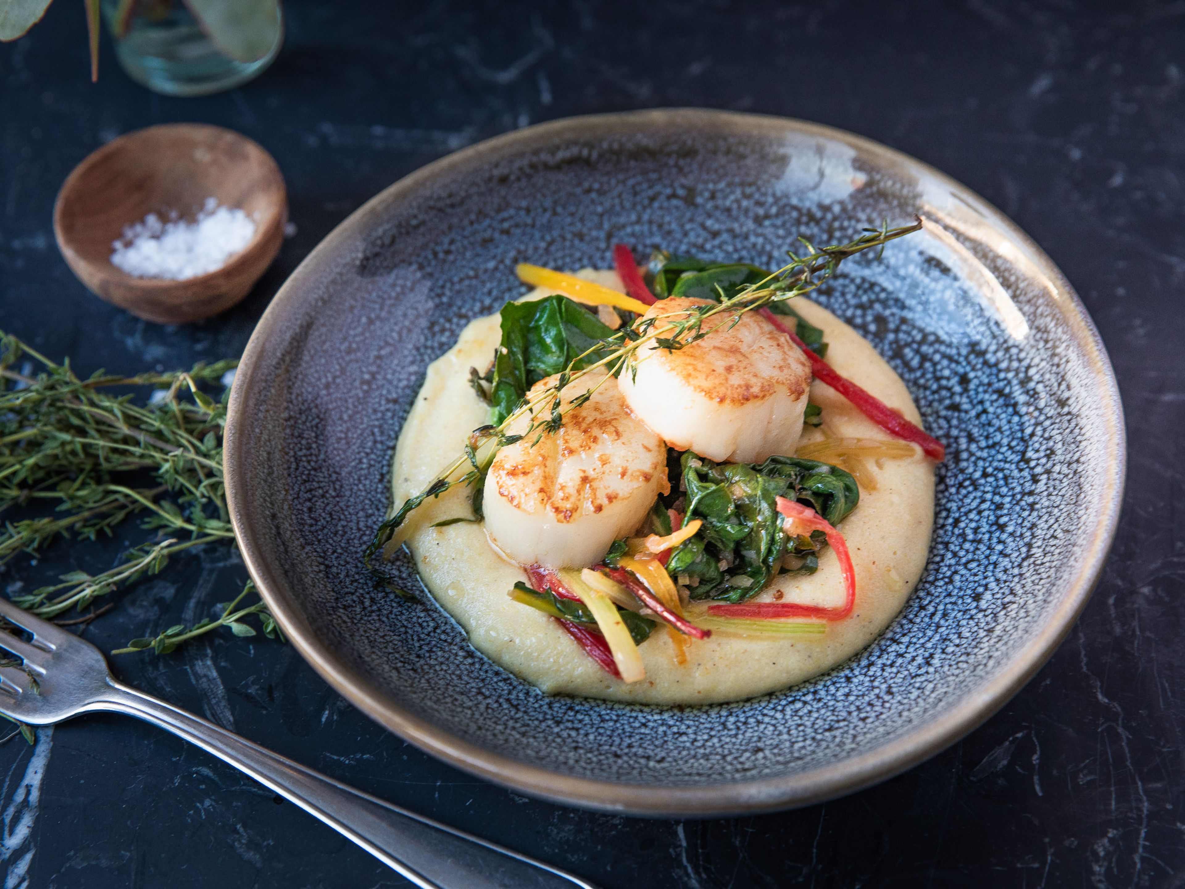 Scallops and sautéed Swiss chard over polenta