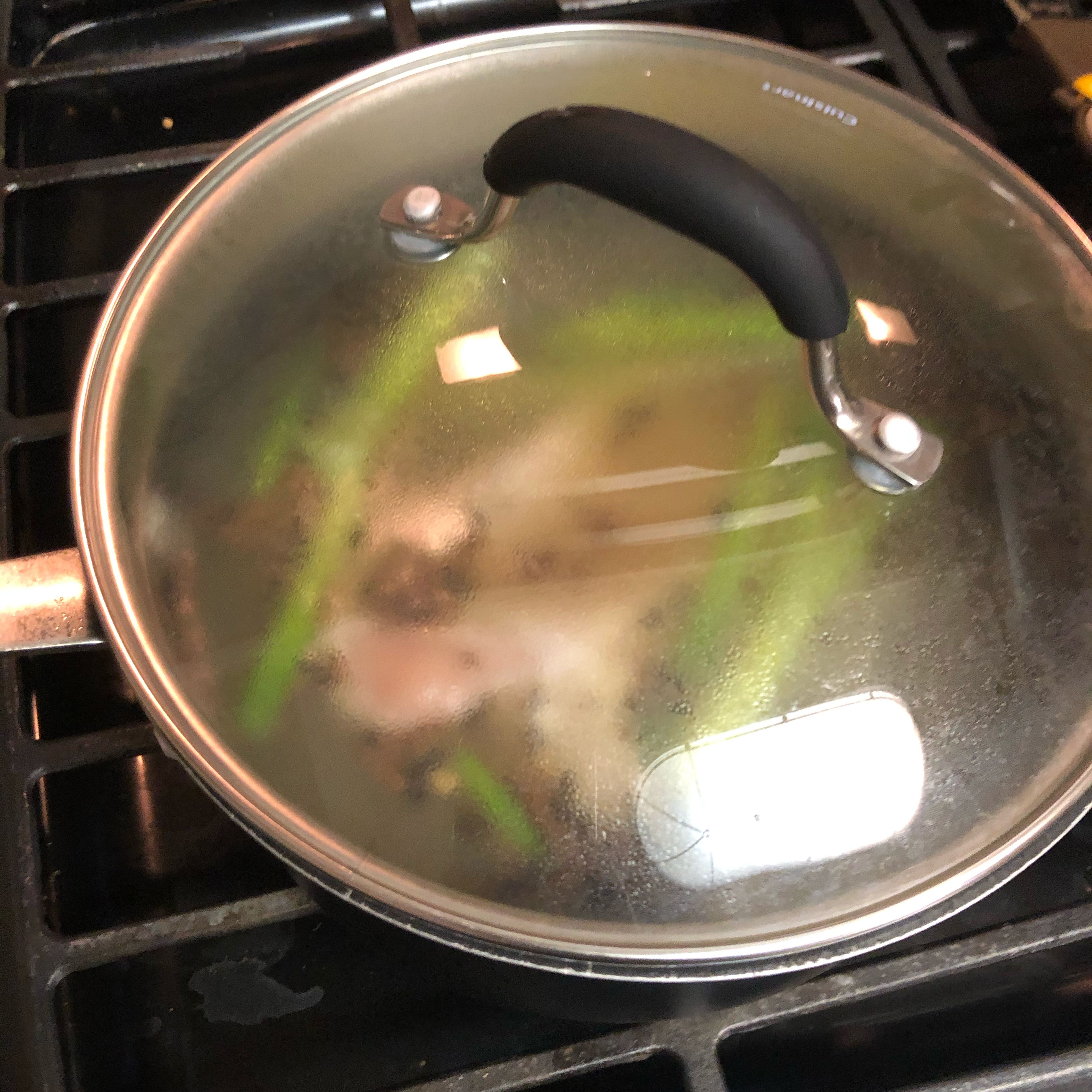 Add in the chicken breast and cover the pot. Let your chicken cook until pink is gone.