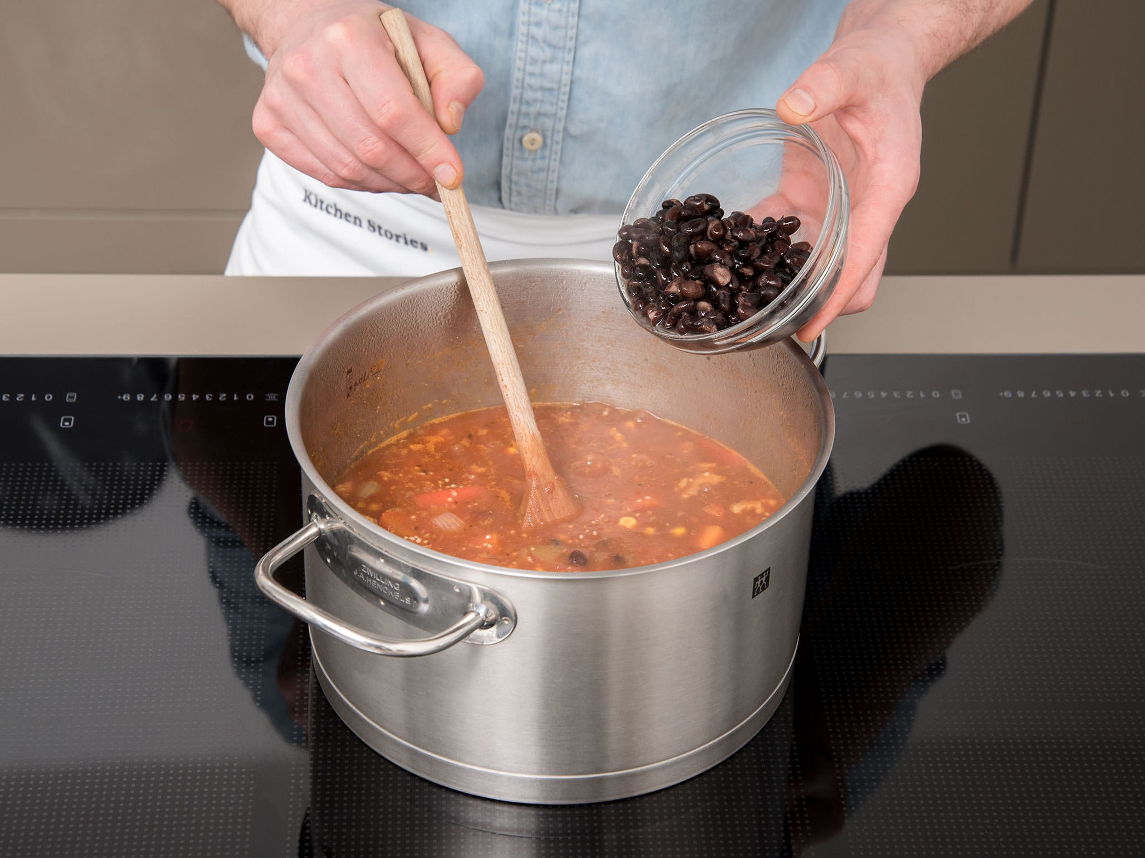 Add crushed tomatoes, vegetable stock, and quinoa to the pot. Season with soy sauce, cane sugar, salt and pepper. Bring to a boil and let cook, covered, for approx. 15 – 20 min. During the last 5 min., add black beans, kidney beans, corn, and walnuts to the pot.