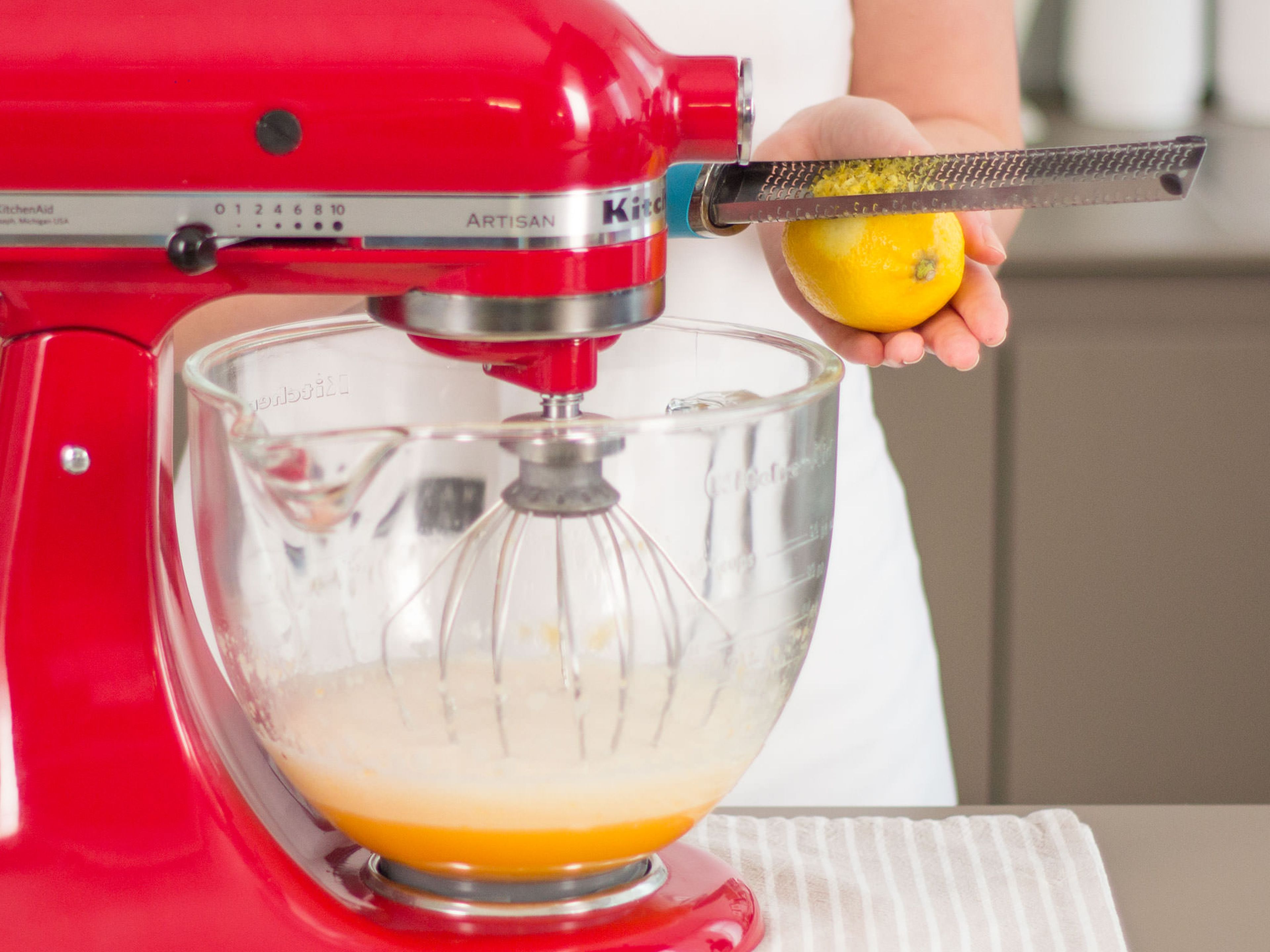 Preheat oven to 180°C/350°F. Add part of the eggs and the sugar to a standing mixer. Beat until the color of the mixture is very pale and it has grown in volume. Add lemon zest. Sift flour, cornstarch, cocoa powder, and salt into the mixer bowl. Beat until a smooth dough forms.