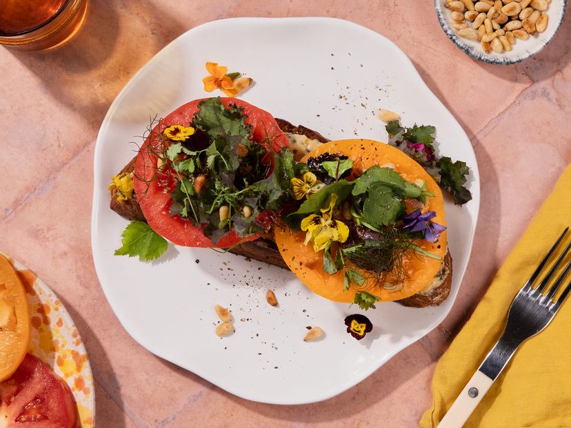 Heirloom tomato sandwich with anchovy butter and herby salad