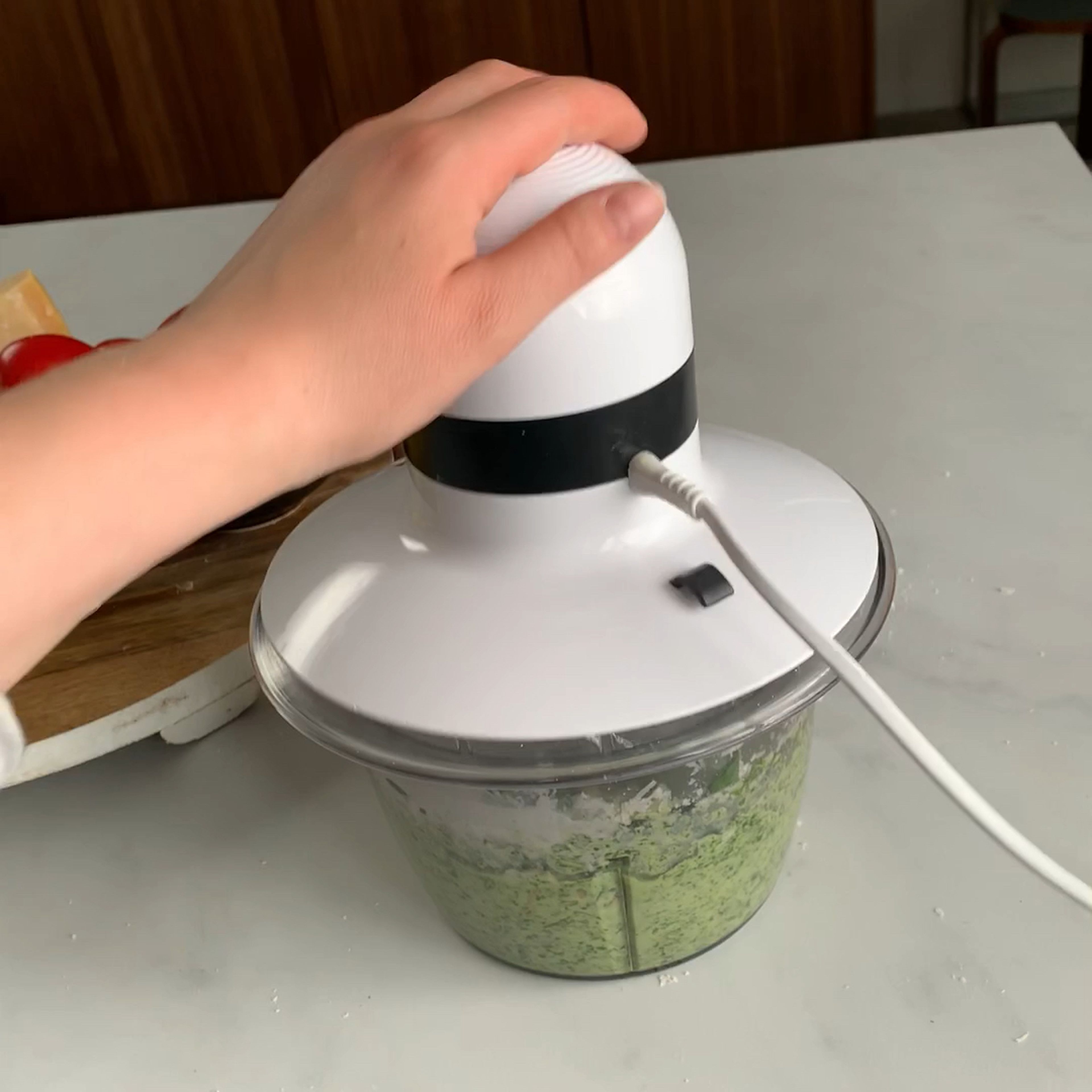 Blend arugula, basil, almonds, yogurt, lemon juice, parmesan, salt, and pepper until smooth