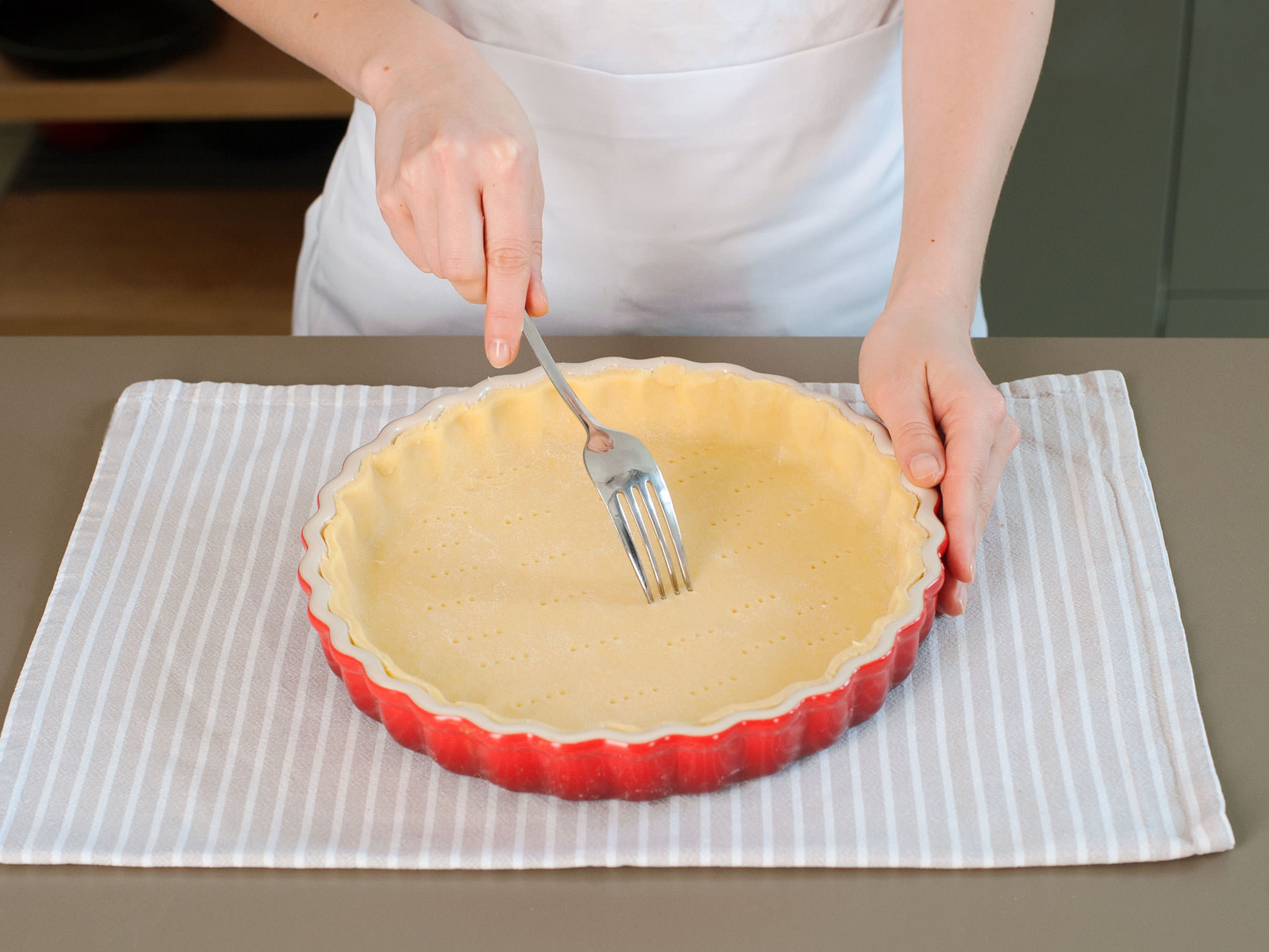 Preheat oven to 180°C/350°F. Roll out dough, gently press into a greased pie dish, and poke with a fork.