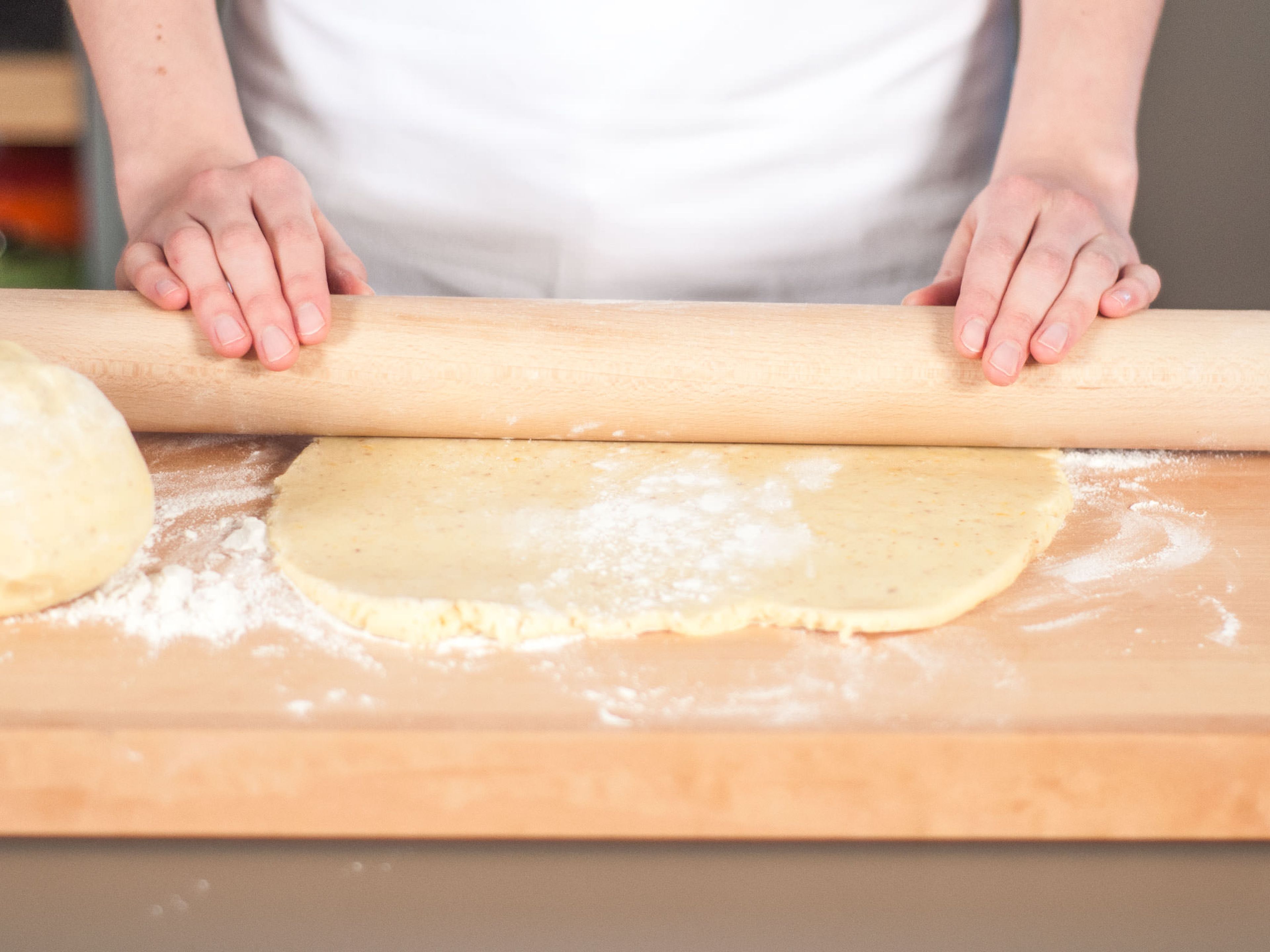 If necessary, grease pie dish and lightly flour work surface. Divide dough into two parts. Using a rolling pin, roll out so that each piece is slightly larger than the pie dish. Carefully transfer one dough round to pie dish and press into the dish. Cut off overhanging dough by rolling the rolling pin over the edges of the dish.