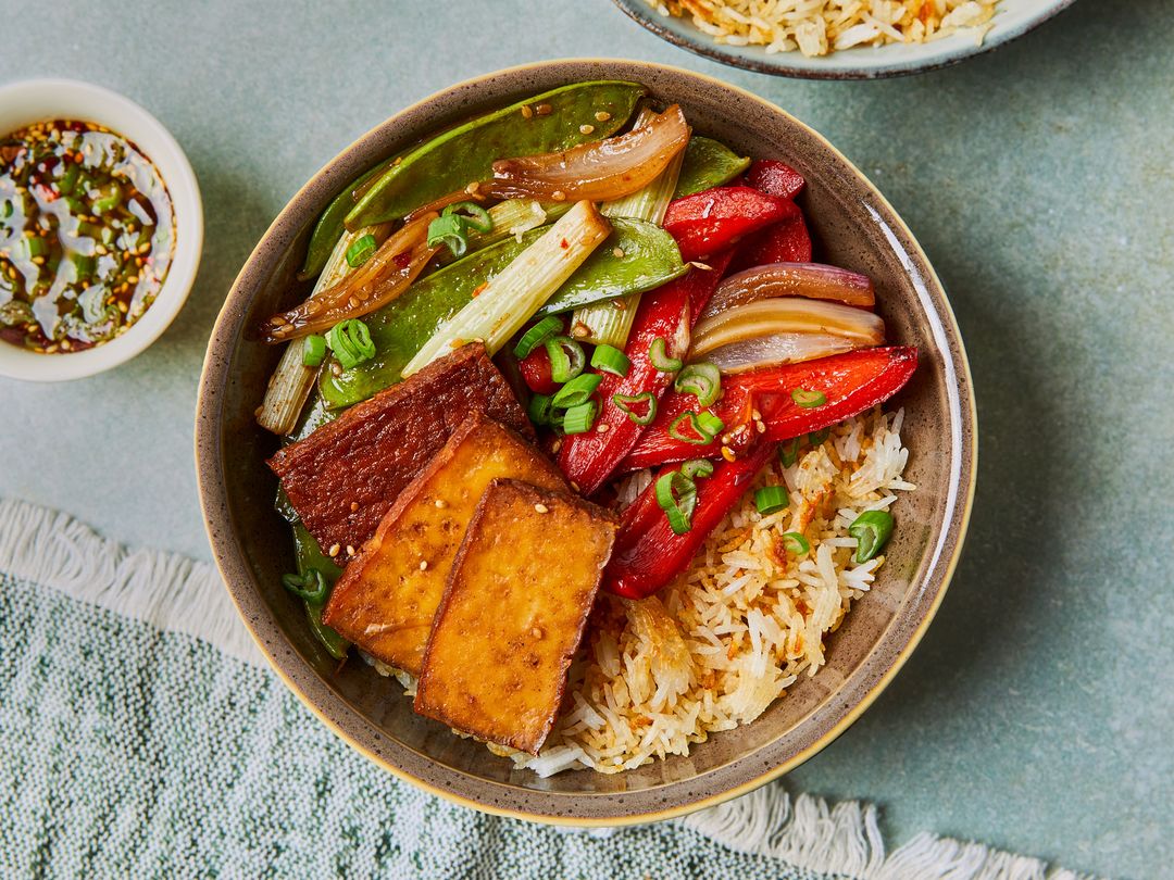 Spiced baked tofu with crispy rice and vegetables