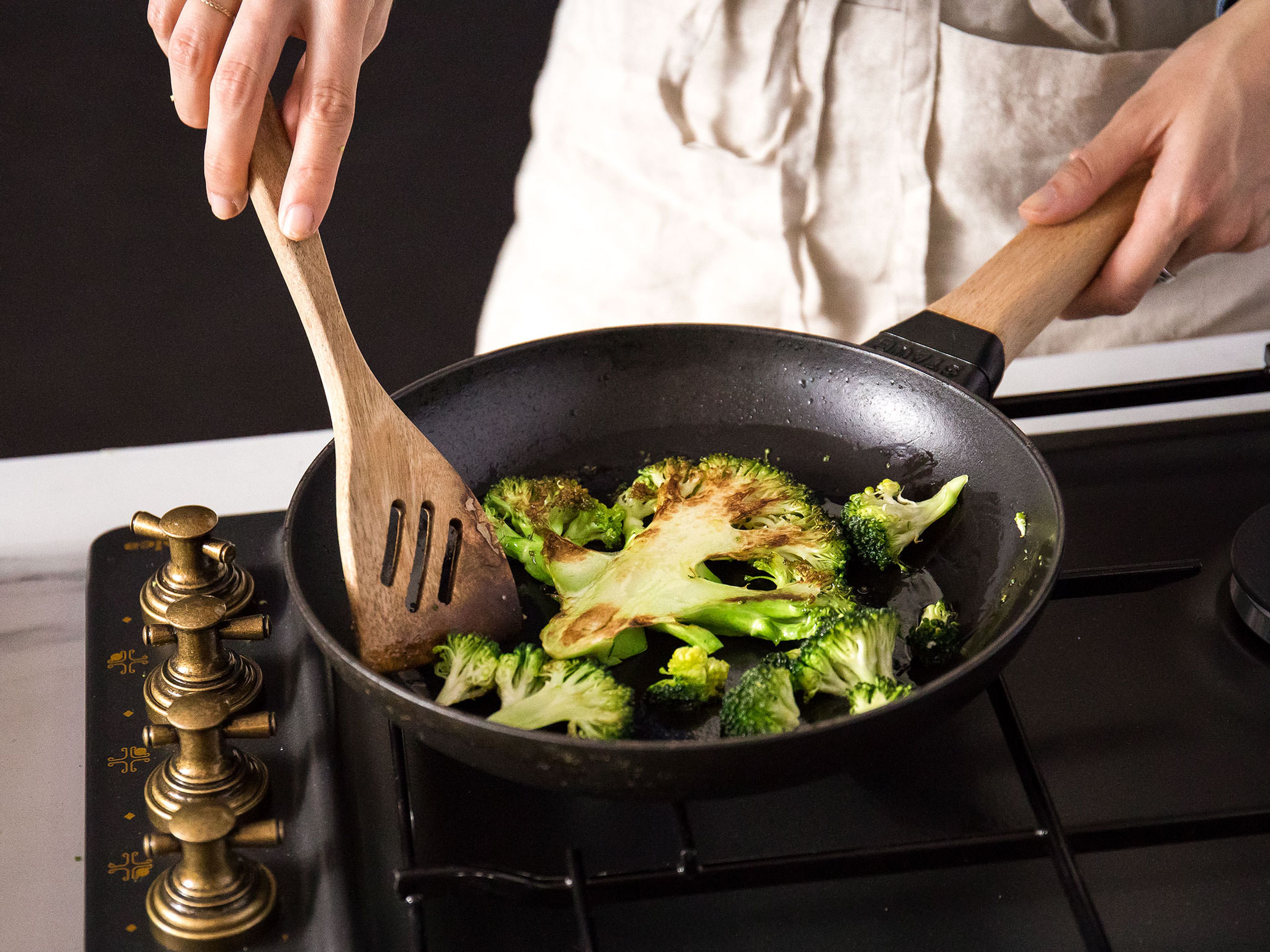 Heat the same frying pan used to toast the hazelnuts over medium-high heat, add olive oil, and lay in the sliced broccoli cut-side down. Cook on each side for about 1 - 2 min. or until browned.