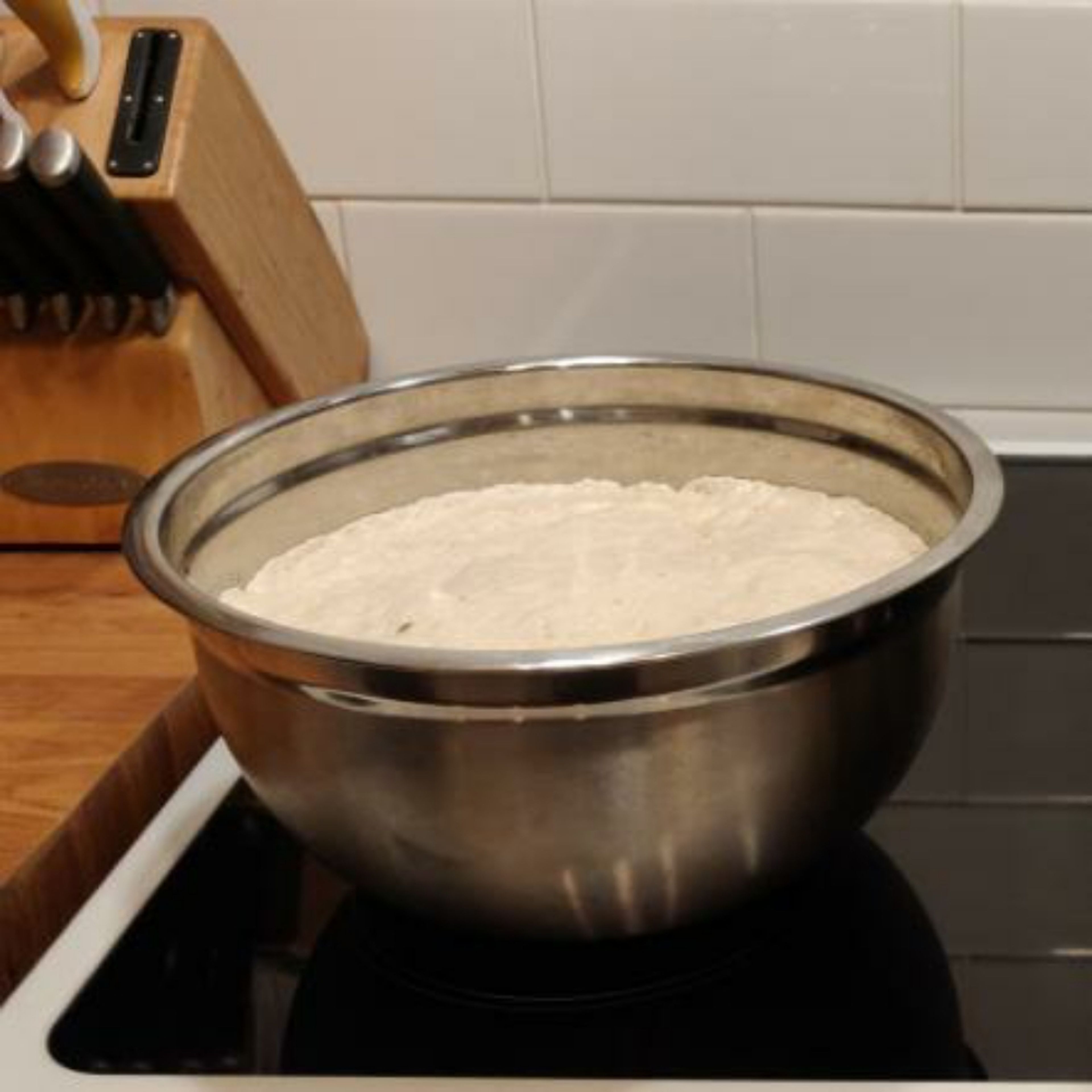 form the dough into a ball and place ie to a well oiled bowl. cover the bowl with cling film/plastic wrap and leave in a warm place for 1-2 hours.