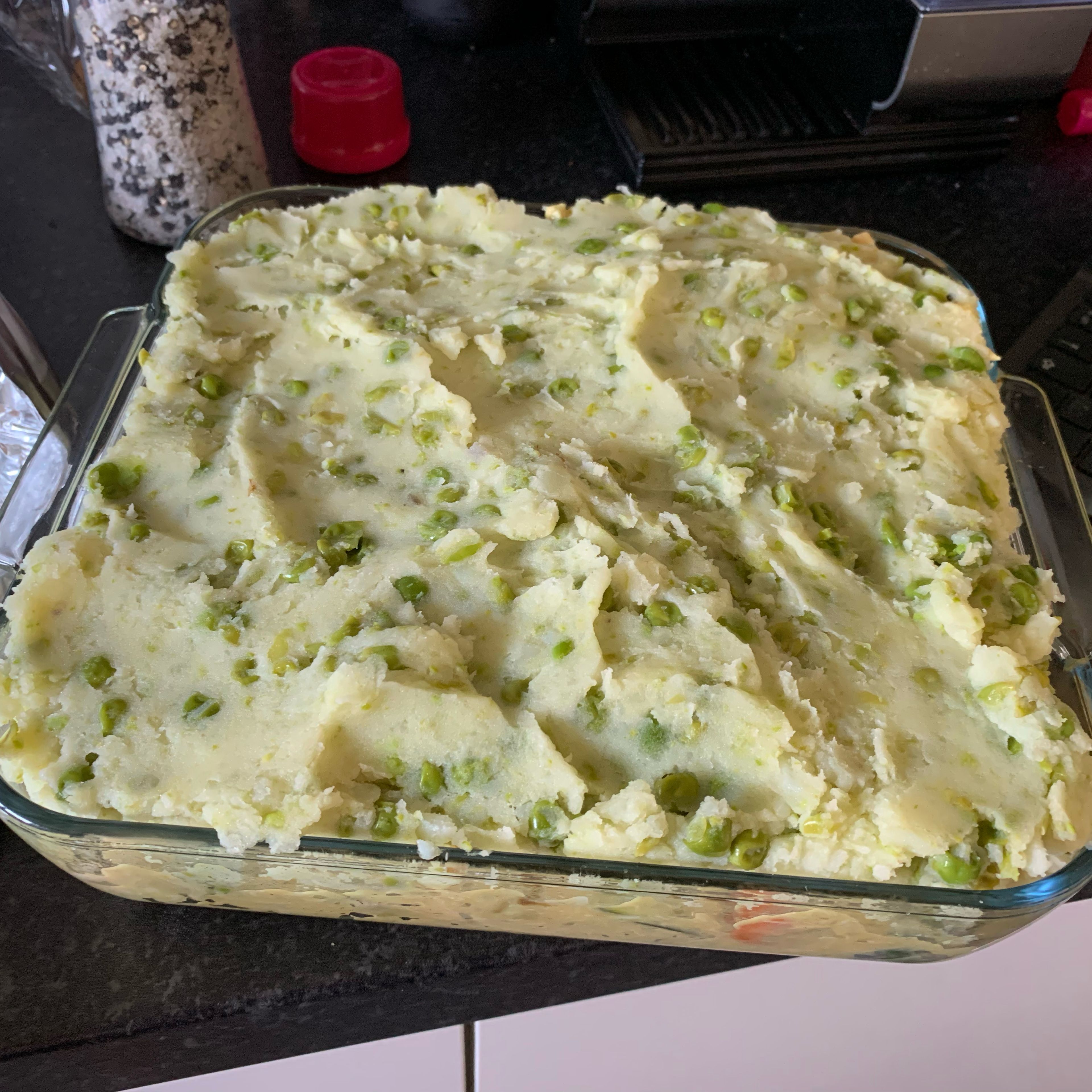 Top with the pea-spiked mash and smooth out, scuffing it up slightly with a fork to give it texture that will crisp up. Bake for 30-40 minutes, or until beautifully golden. Serve with a good old helping of baked beans (if you like). Delicious!