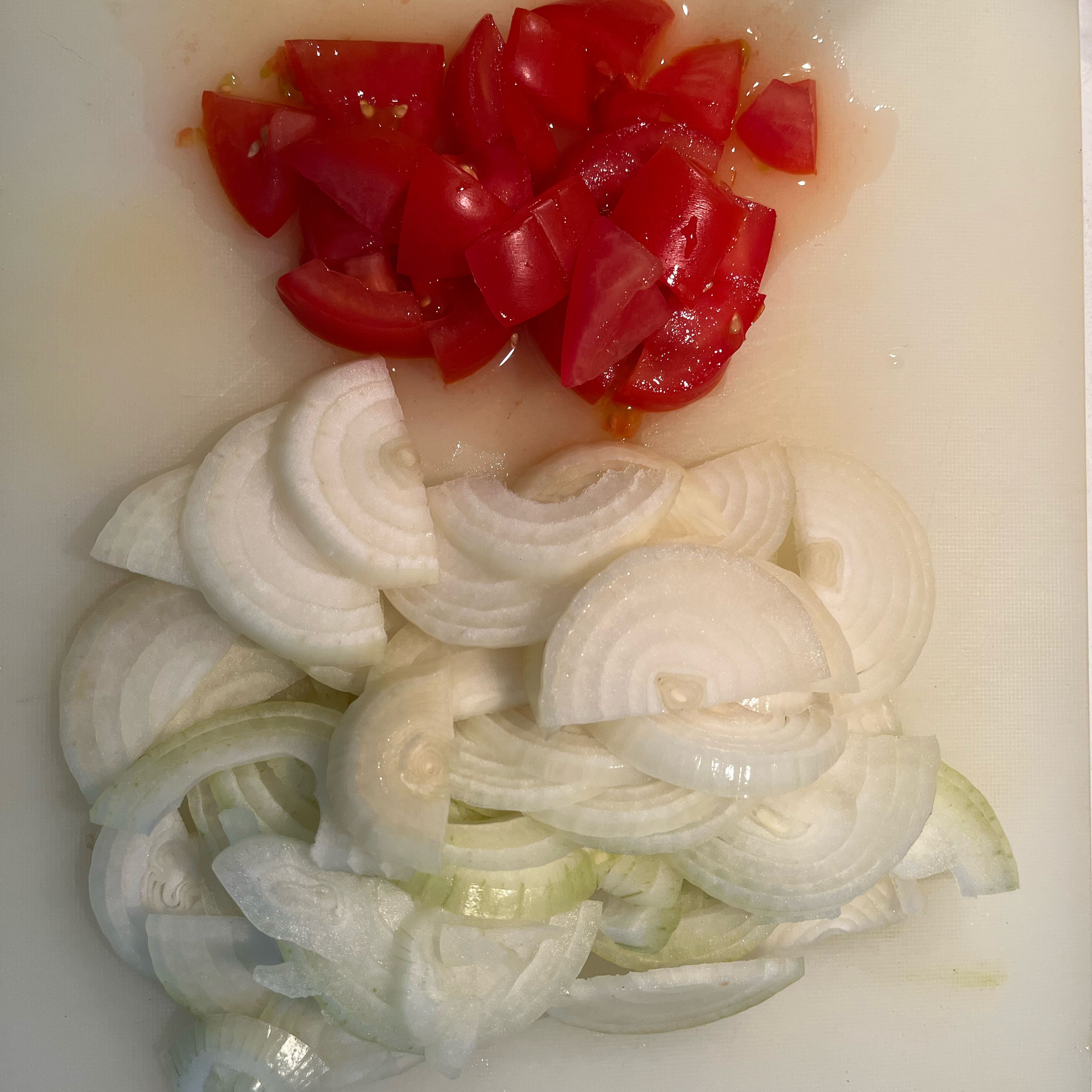 Peel and slice onions, dice tomato.