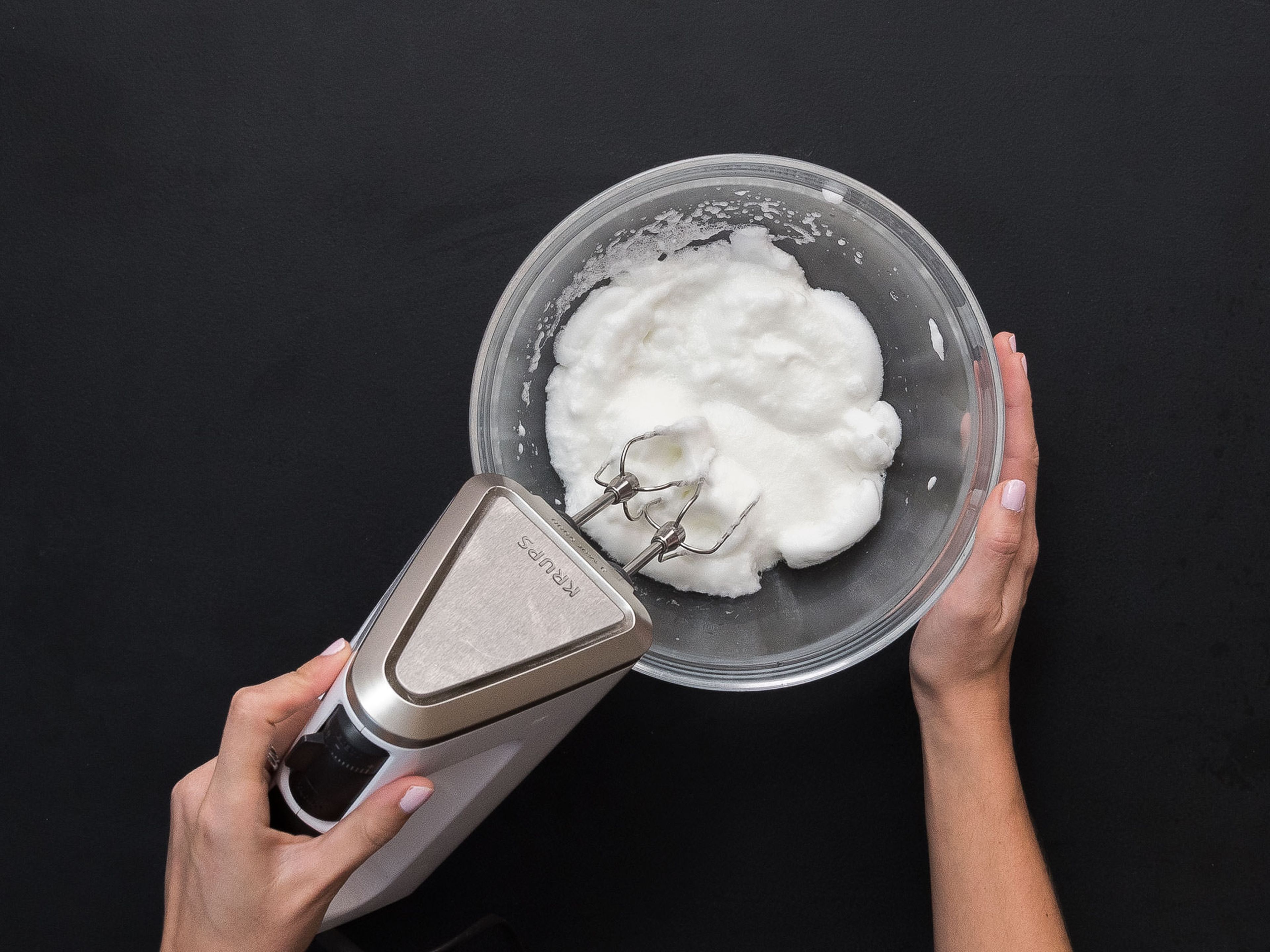 Beat egg whites with hand mixer until stiff peaks form.