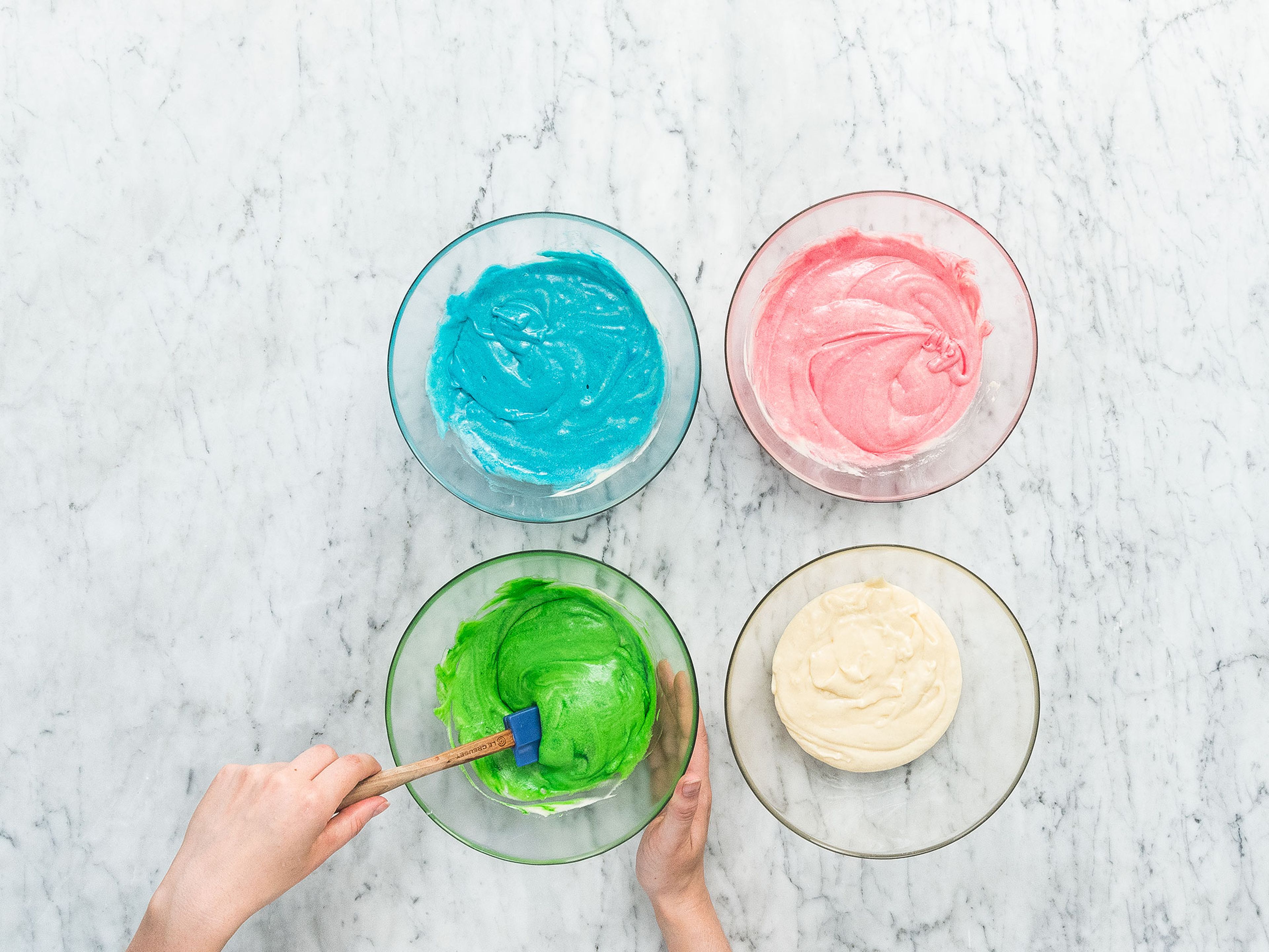 Divide batter equally into four bowls. Add red food coloring to the first bowl, green food coloring to the second bowl, blue food coloring to the third bowl, and leave the fourth one plain.