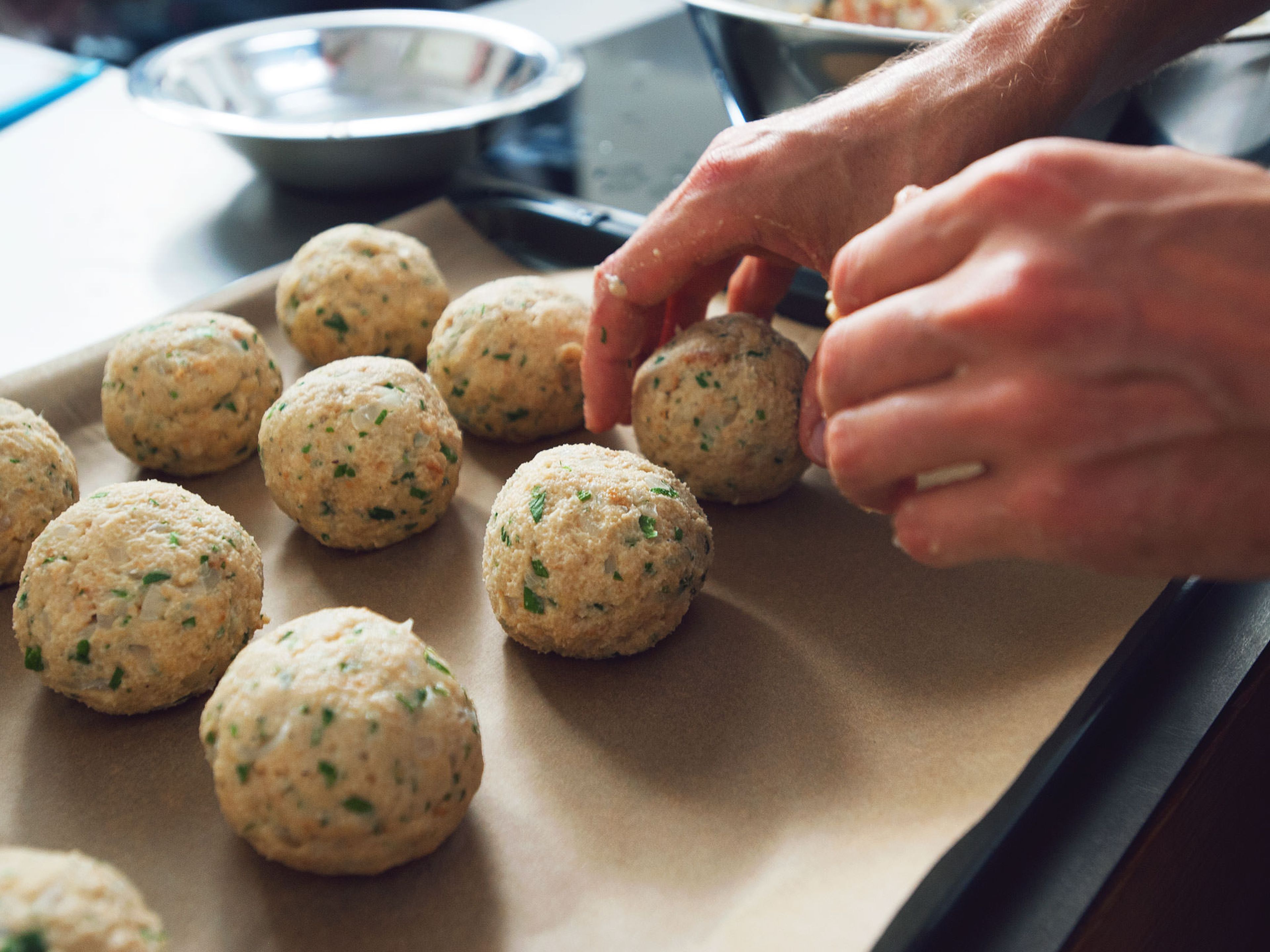 When test dumpling succeeds, form balls out of remaining dough and place them on a baking sheet lined with parchment paper. Add all bread dumplings to saucepan, being careful to arrange them so that they don’t lie on top of each other. Let them simmer for approx. 20 min. Pay attention that water doesn’t boil again.