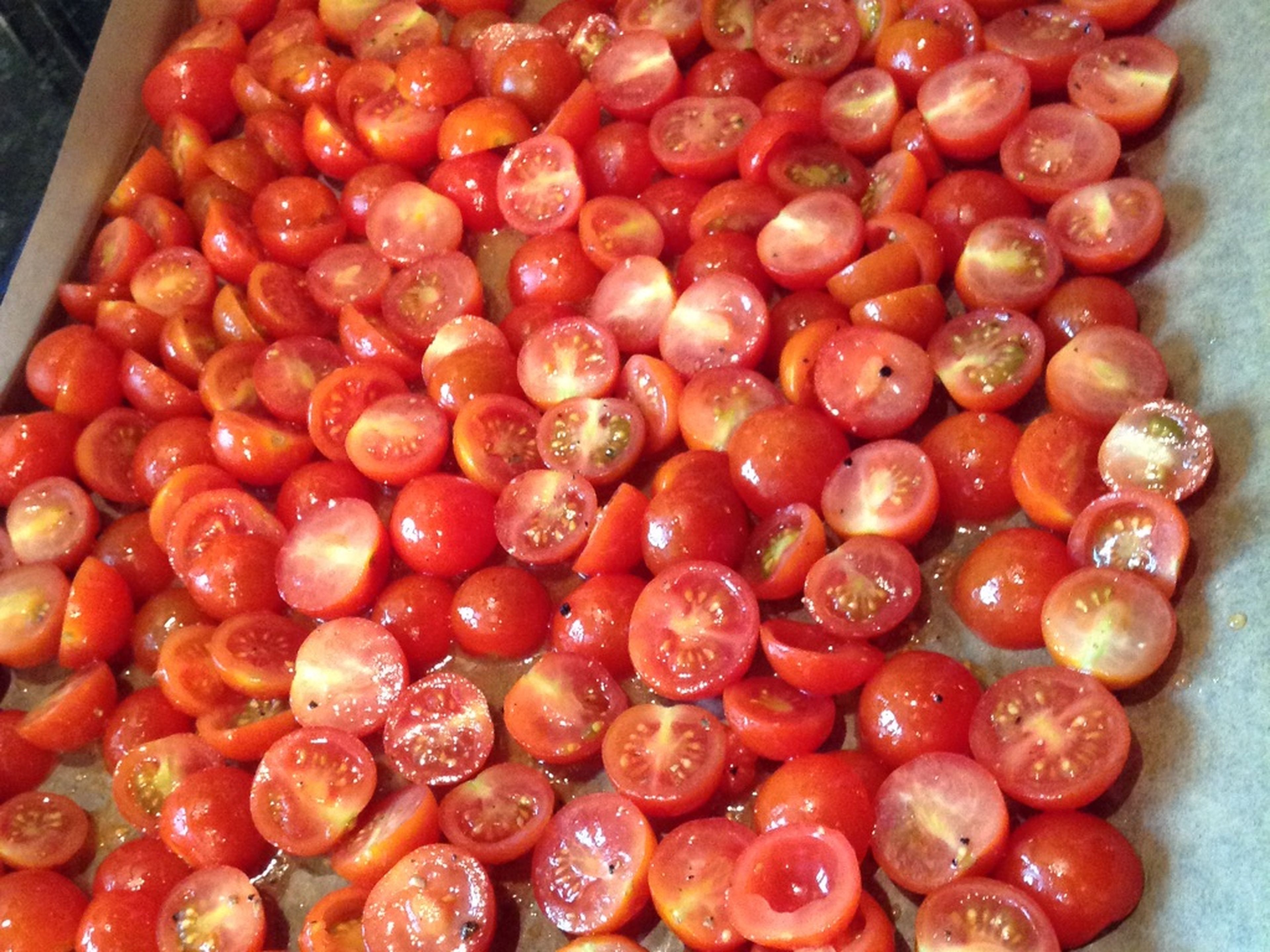 Spread tomatoes onto a parchment-lined baking sheet, making sure that most are skin-side down. Season with salt and pepper and bake in the oven at 170°C/340°F for approx. 30 – 35 min.