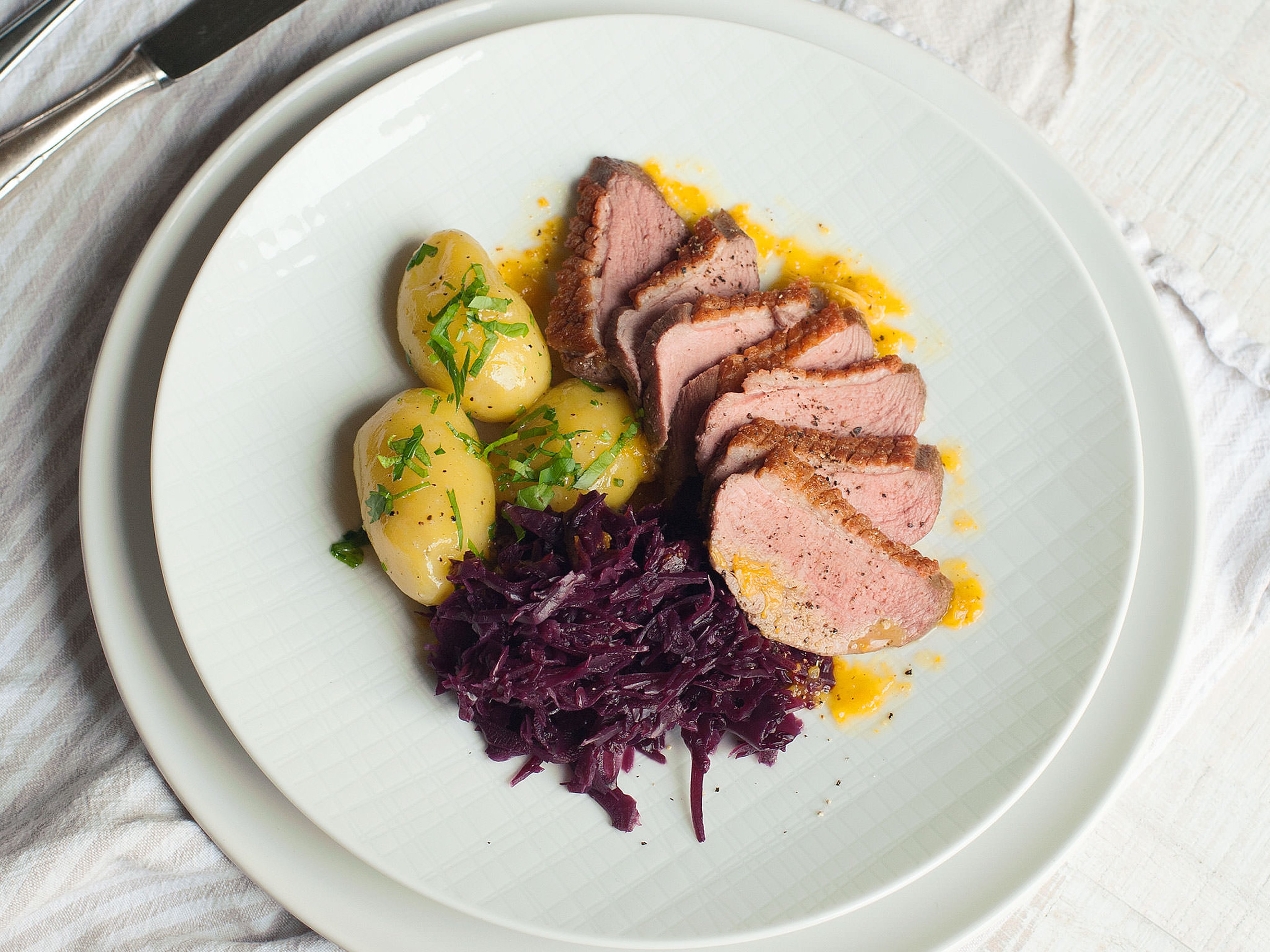 Roast duck with red cabbage and new potatoes