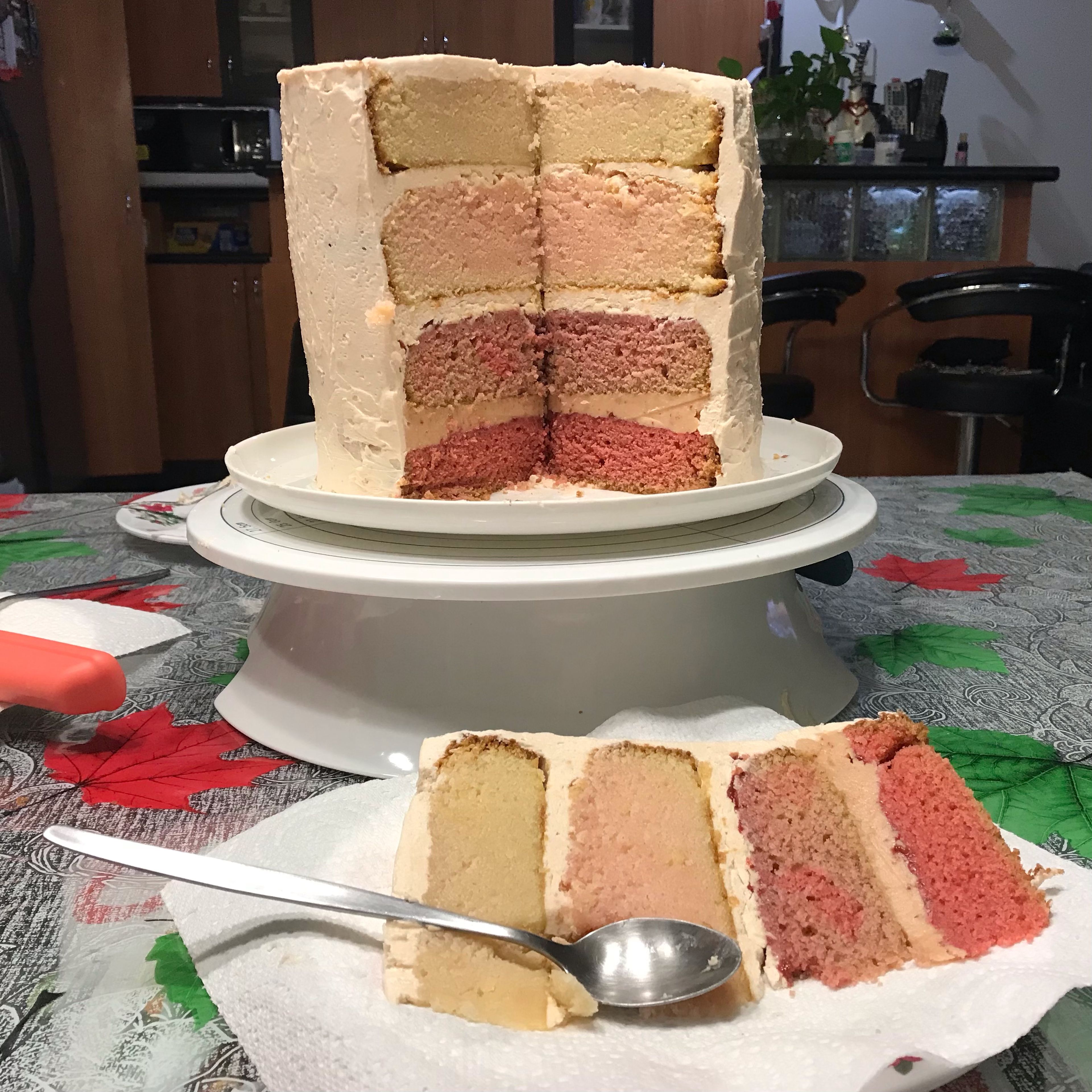 Use an icing scraper or bench scraper to smooth edges, wiping clean in between each use. Decorate as desired. (Here is a picture from the second time I’ve made the cake.)