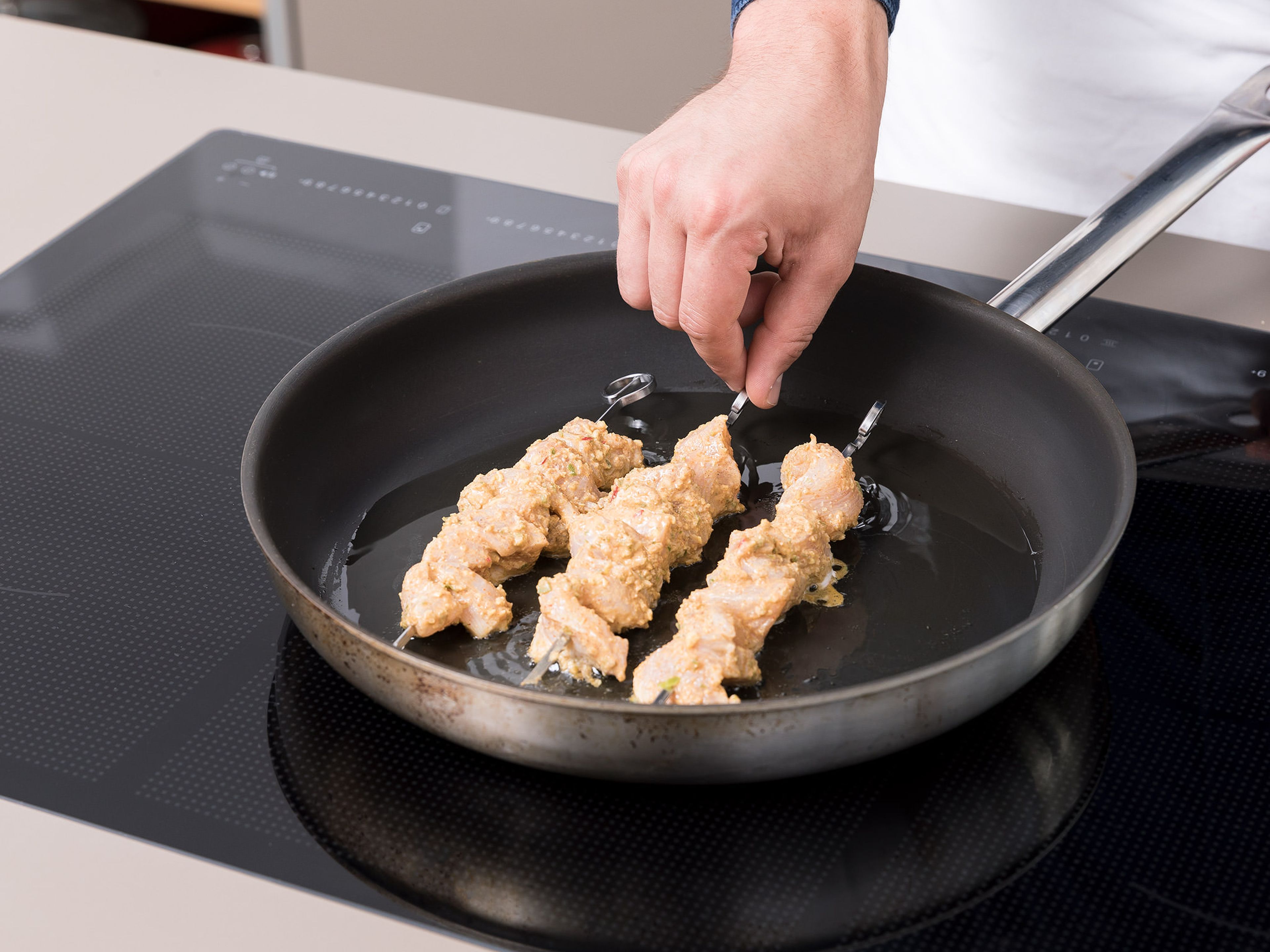 Add vegetable oil to a frying pan over medium heat, and fry chicken until cooked through. Alternatively, you can thread the chicken onto skewers and fry them on all sides. Serve warm with parathas. Enjoy!