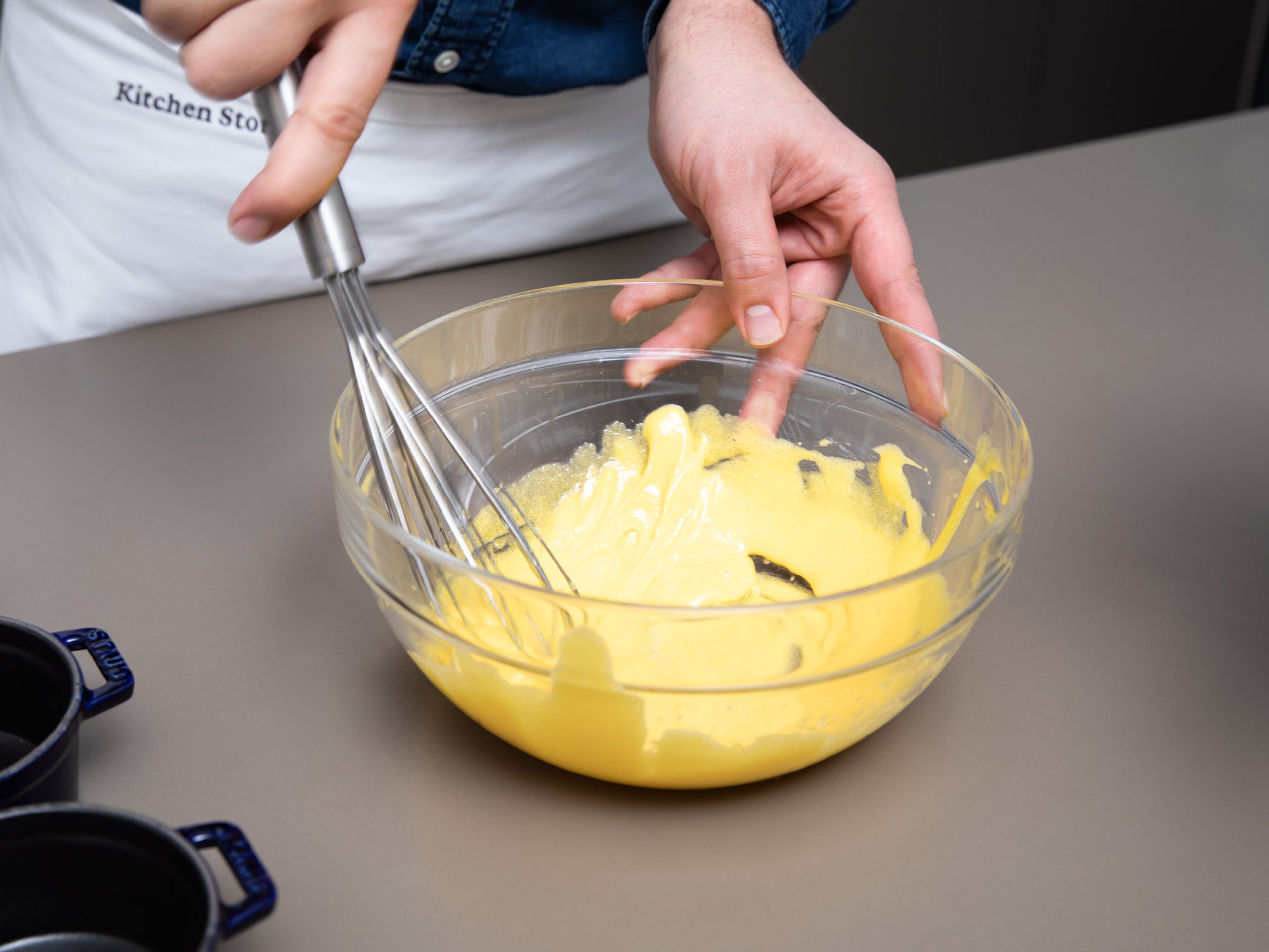 Add egg yolks and some sugar to a bowl and whisk until foamy. Stream in the hot milk and cream mixture while whisking continuously.