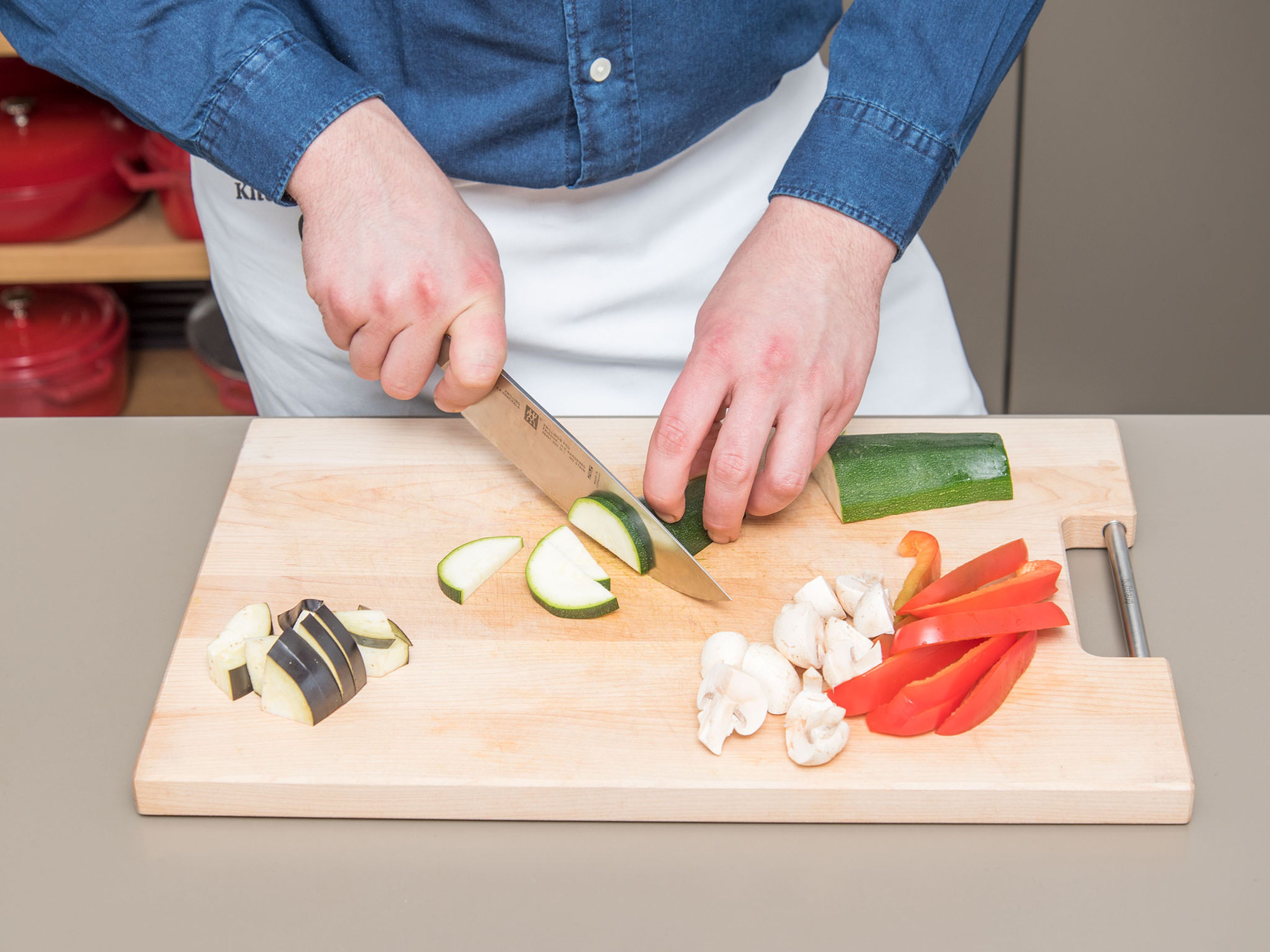 Remove the core of the bell peppers and cut into thin slices. Halve zucchini lengthwise, quarter eggplant, and halve mushrooms. Slice zucchini, eggplant, and mushrooms and transfer to a bowl.