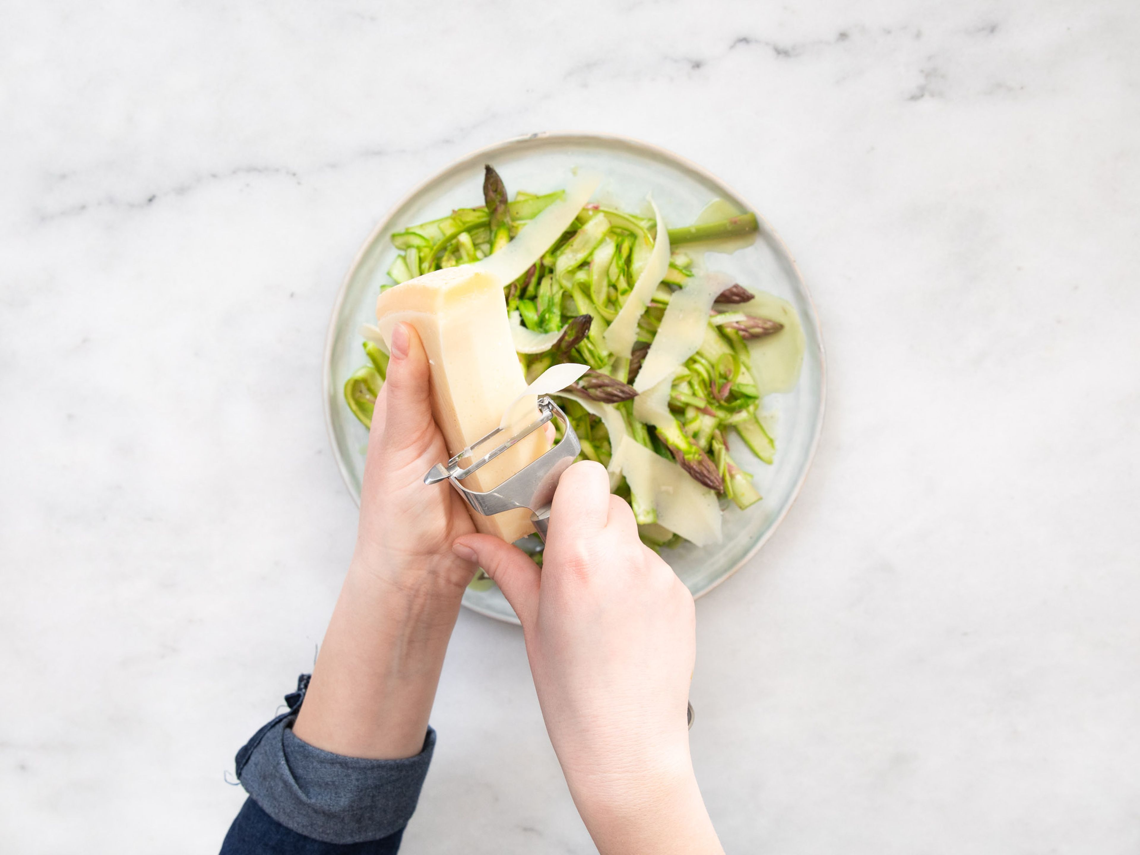 Toss the asparagus and the dressing together. Let sit approx. 5 min before serving. Serve salad, use a peeler to shave wide strips of freshly-shaved Parmesan on top and garnish with fresh thyme leaves. Enjoy!