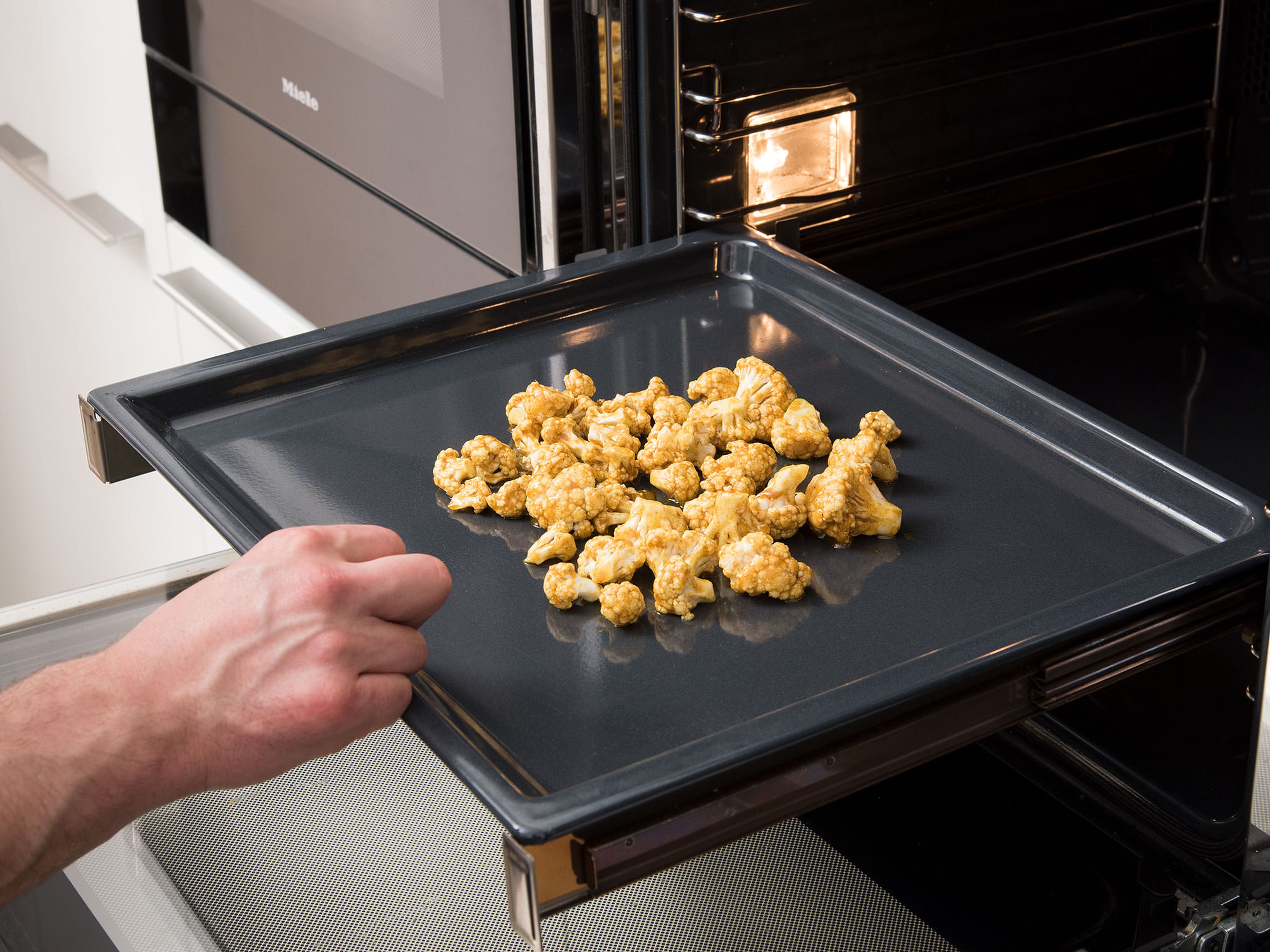 Transfer the marinated cauliflower onto a baking sheet. Roast in the preheated oven for approx. 25 min. or until slightly crispy. Set aside to cool.
