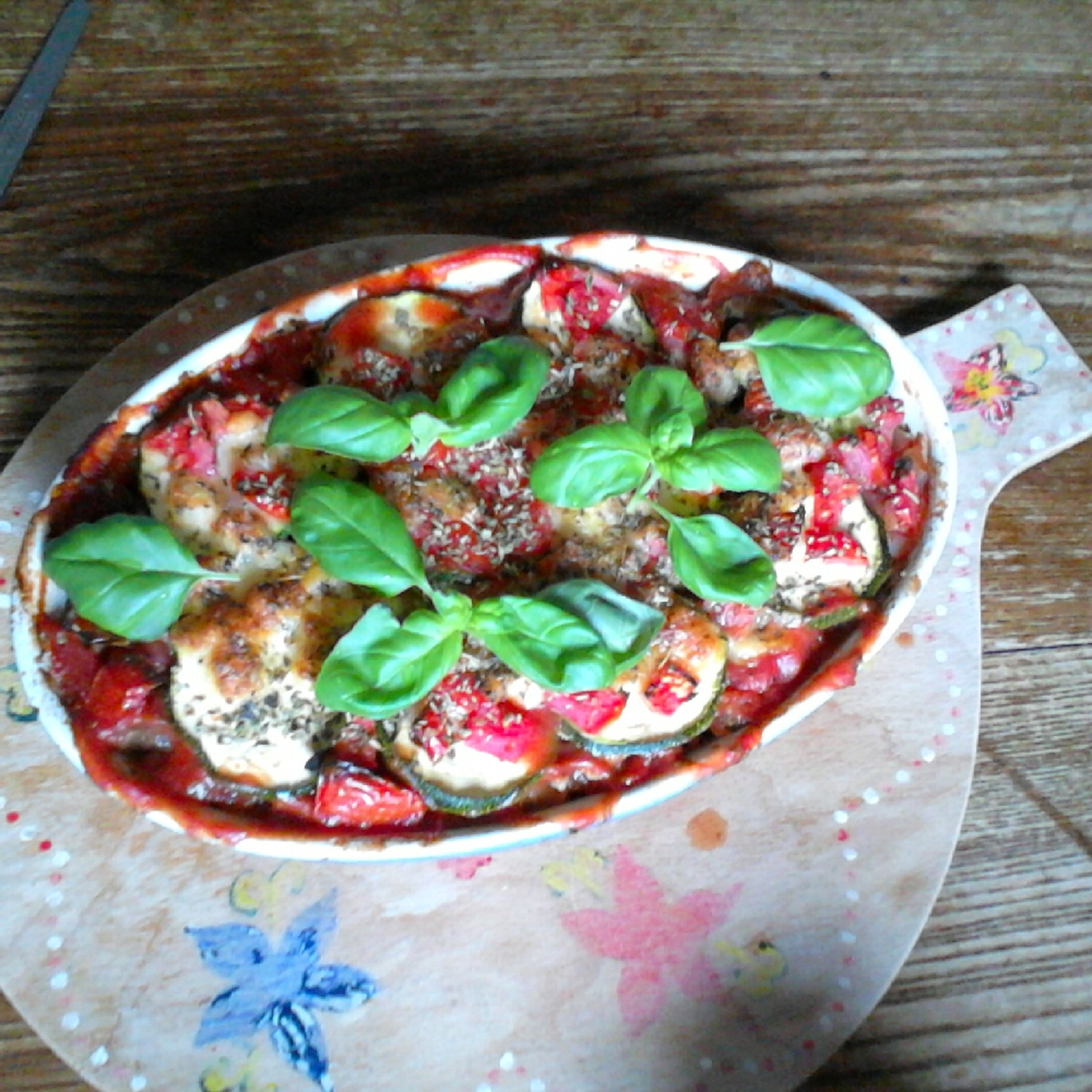 Pasta bake with zucchini, tomato, and Mozzarella cheese