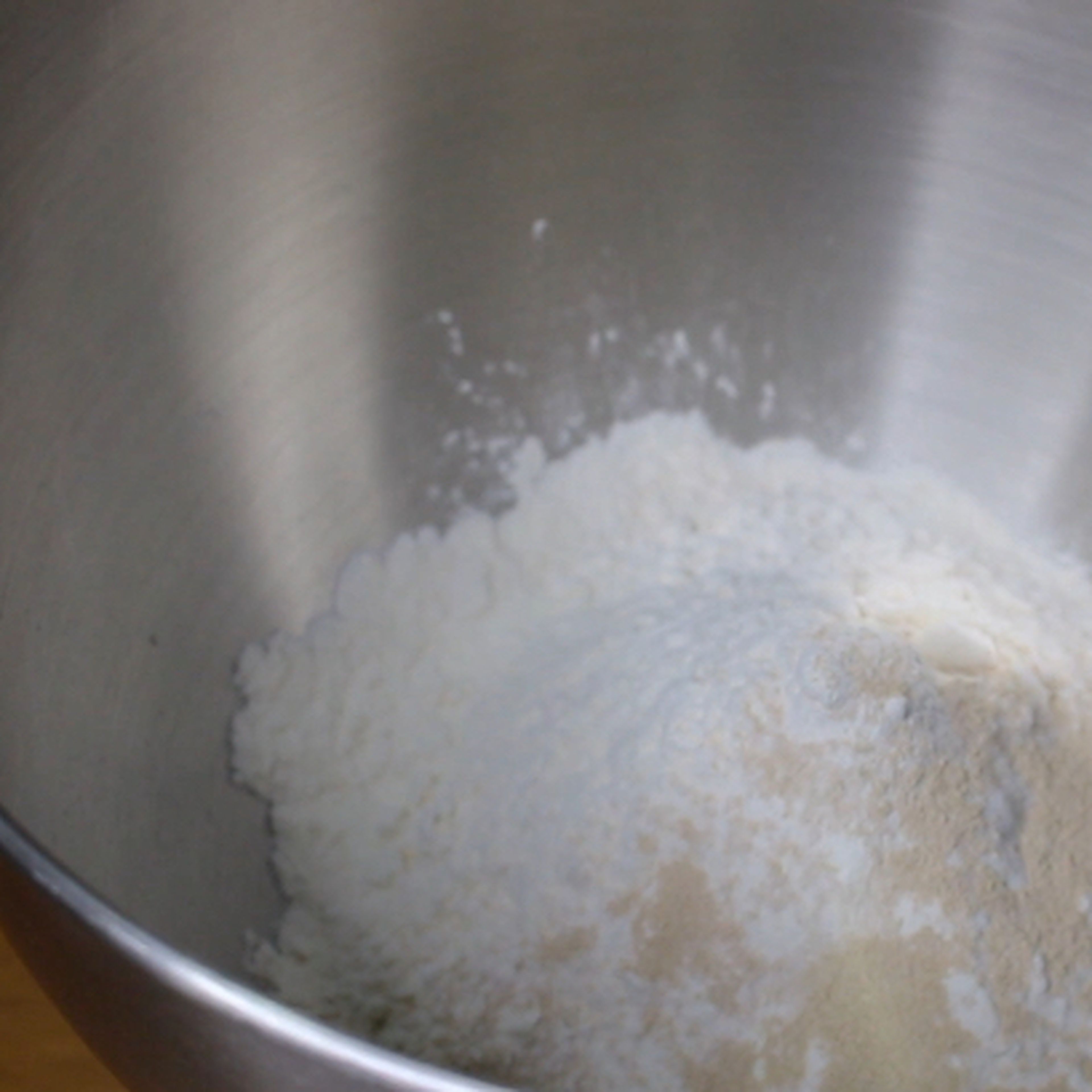 Combined the dry ingredients. (bread flour and active dry yeast) Whisk together until combined.