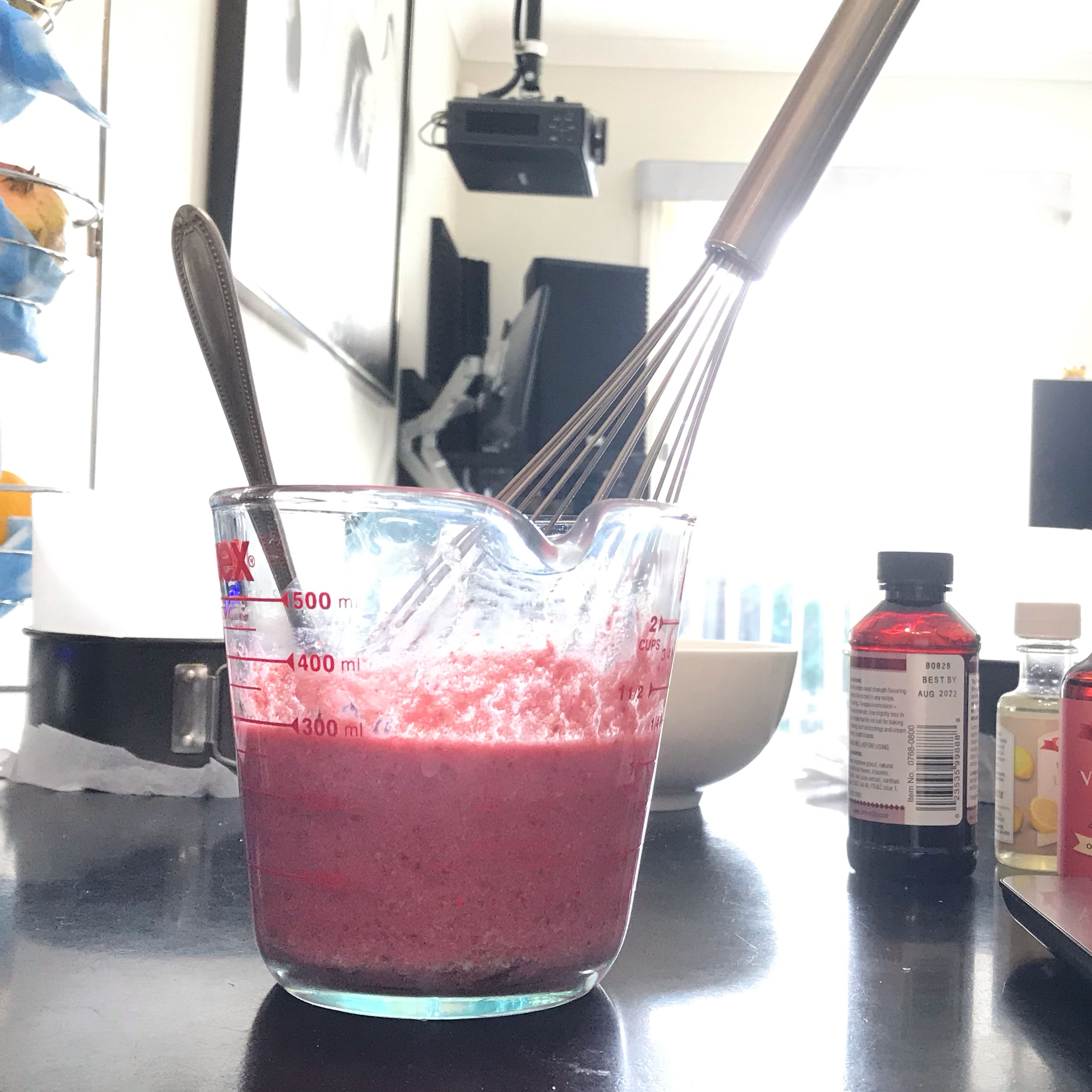 In a separate jug or medium bowl, whisk together the milk, strawberry reduction, strawberry emulsion, vanilla extract, lemon extract, lemon zest, lemon juice, and pink food coloring.