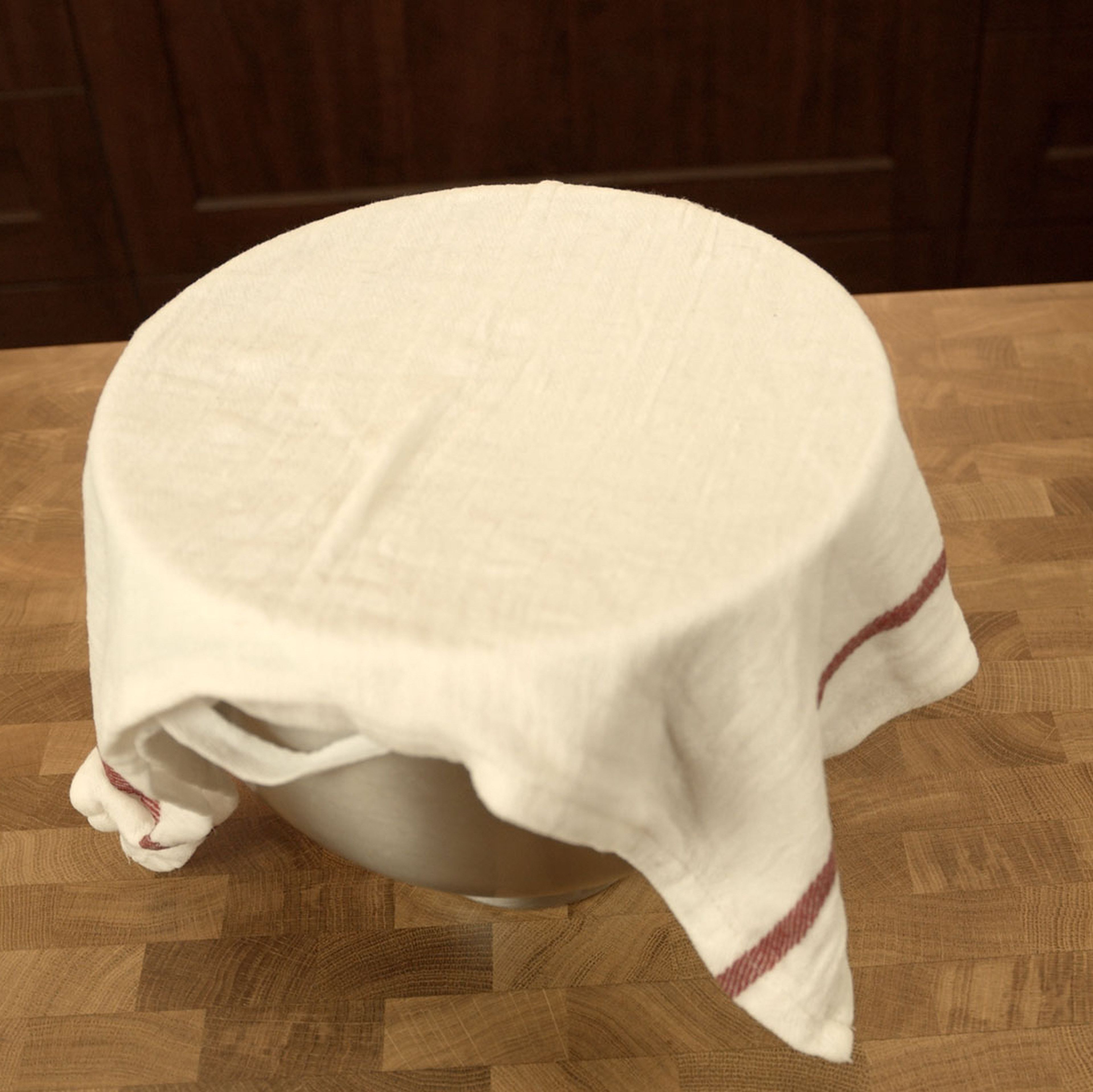 Cover with a wet/damp towel to prevent the dough from drying out