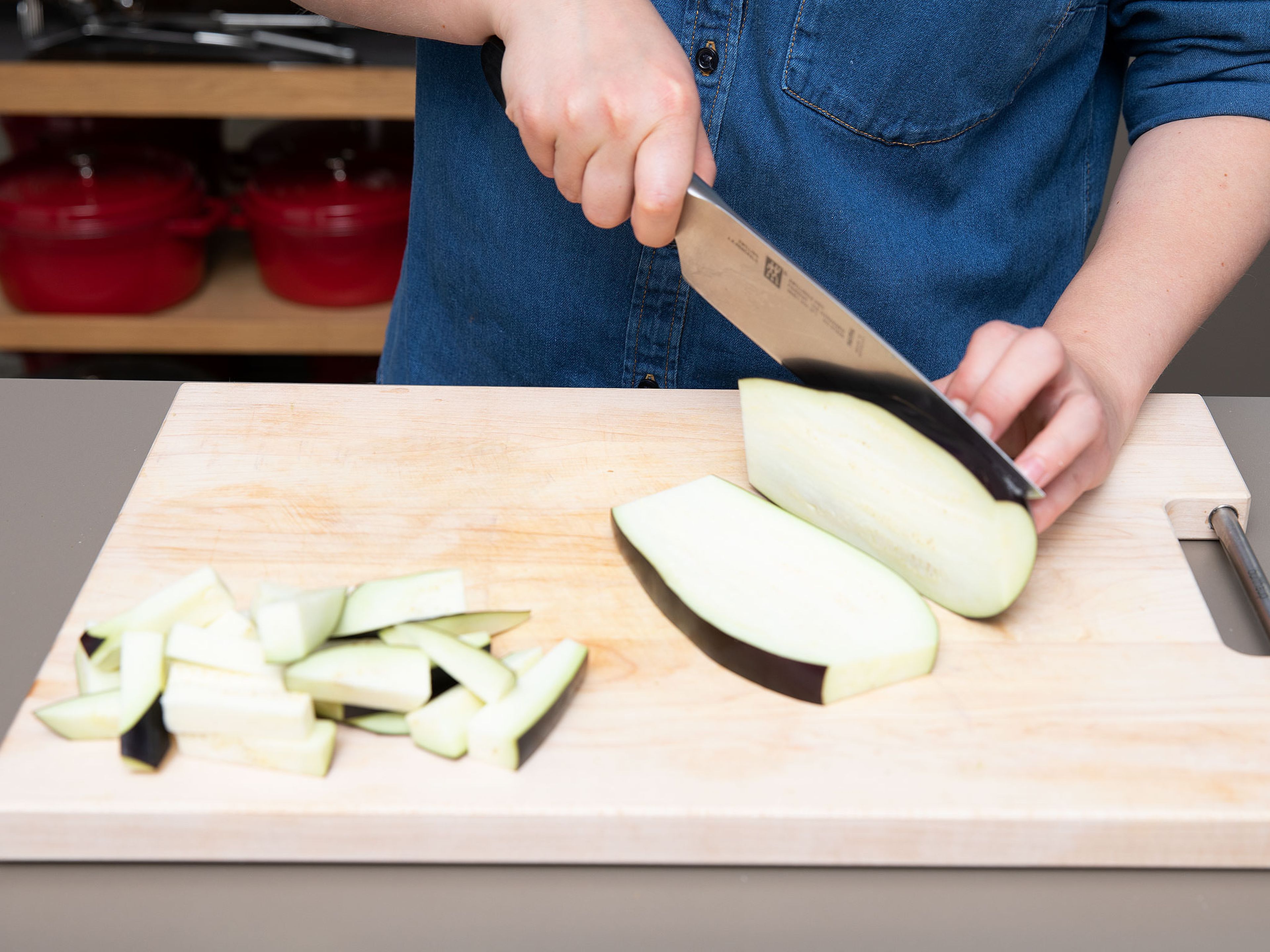 Preheat oven to 180°C/350°F and line a baking sheet with parchment paper. Wash eggplant and trim off the ends. Cut a thin slice off of one side to form a flat base for safe cutting, then cut into thick matchsticks.