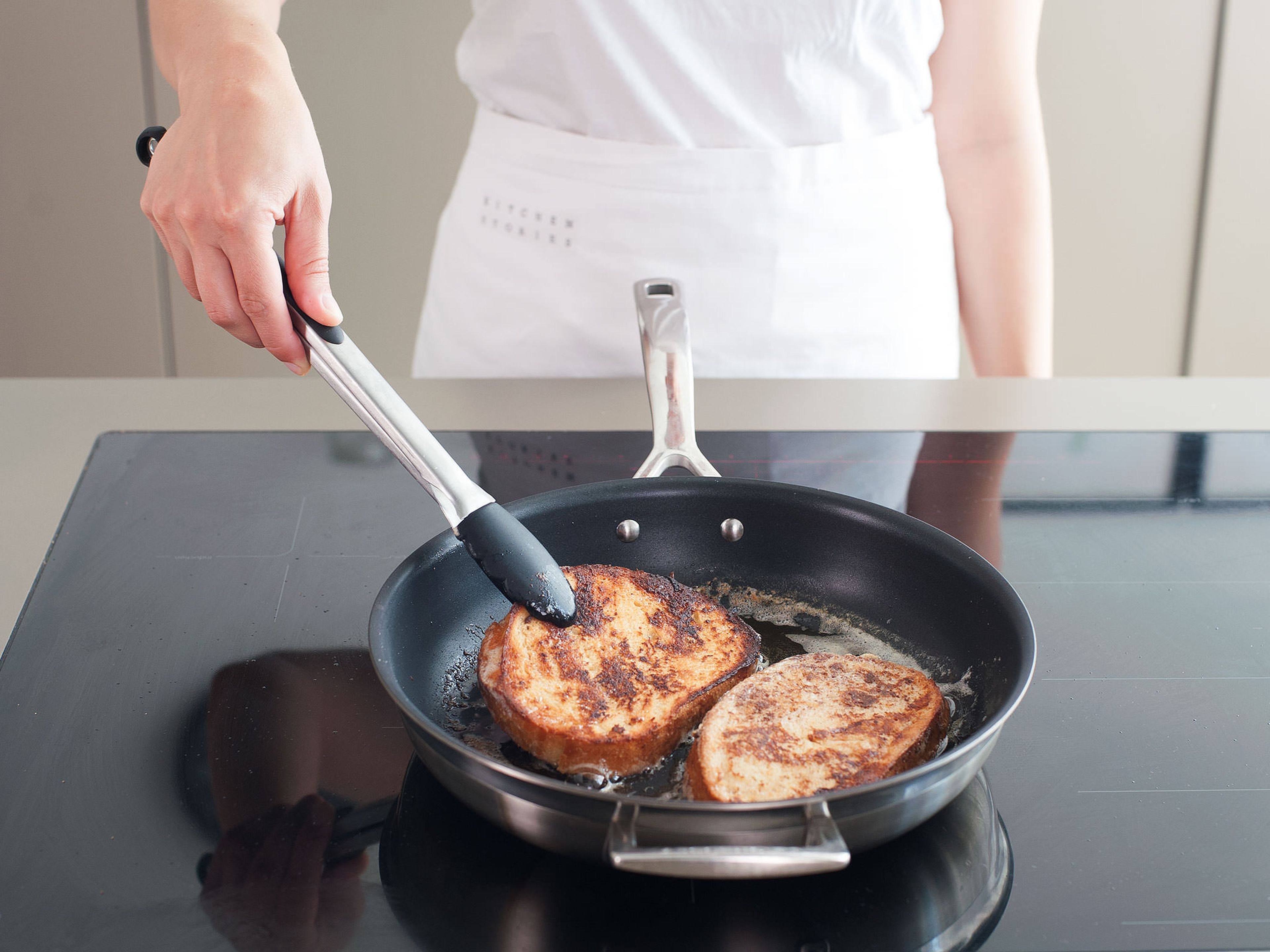 In a frying pan, melt butter over medium heat and sauté bread for approx.  2 – 3 min. per side until golden brown. Cut diagonally and serve with maple syrup.