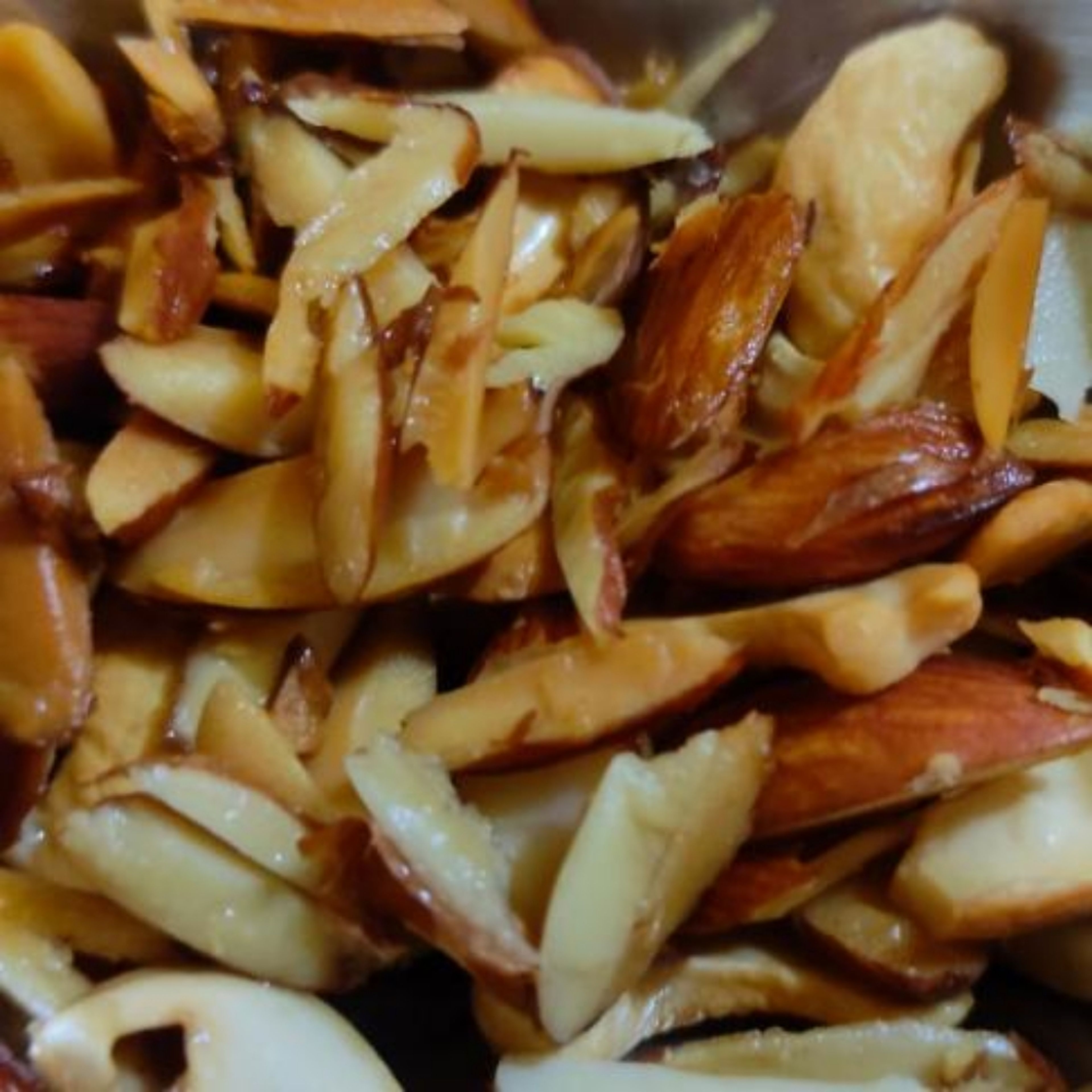 Heat the Ghee in the utensil, and fry chopped almonds and cashews till they turn Golden. Take them out and keep aside