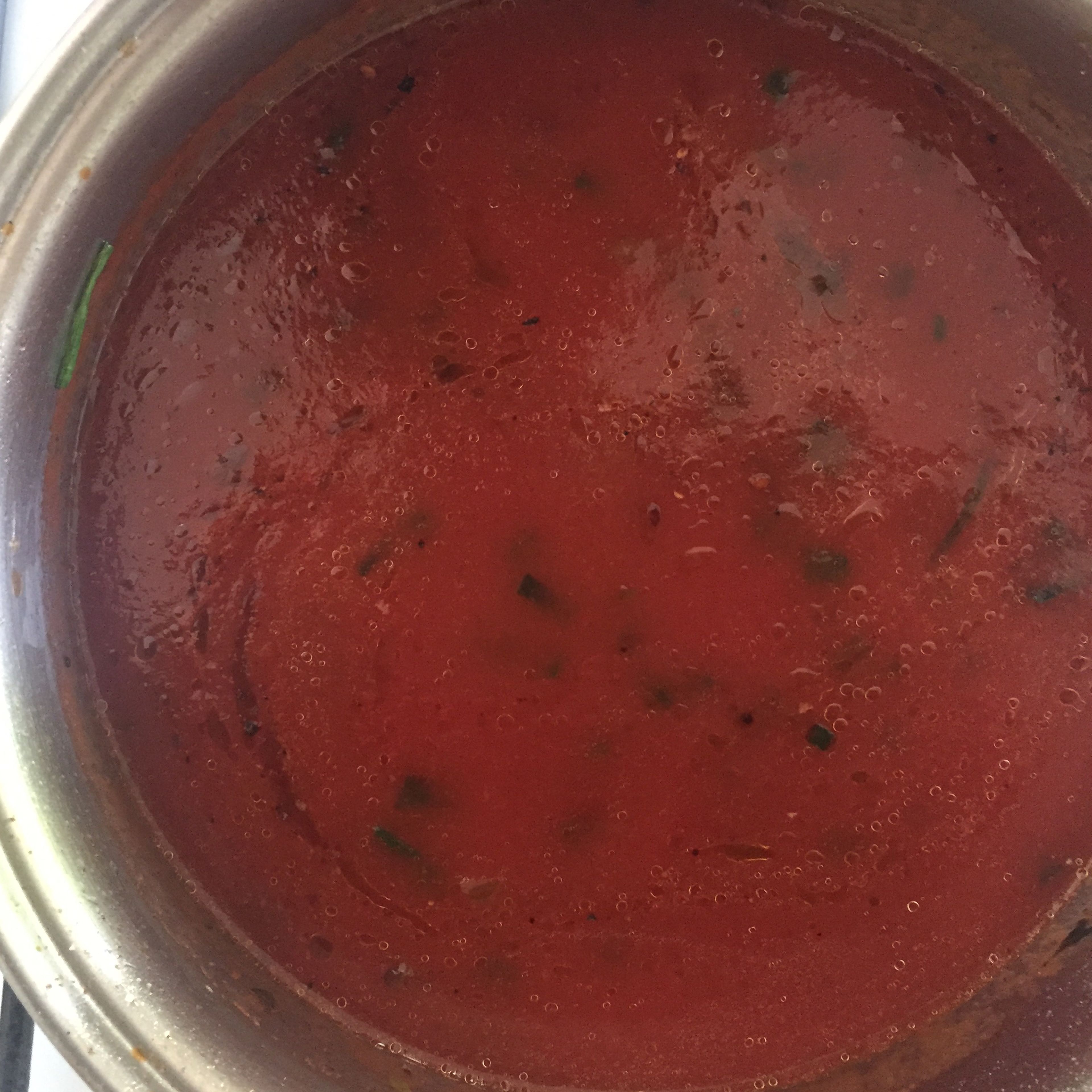 pour in a can of tomato purée, and season to taste. I recommend using oregano, chili flakes, paprika, salt, pepper and sugar. Let boil for a few minutes, then set aside