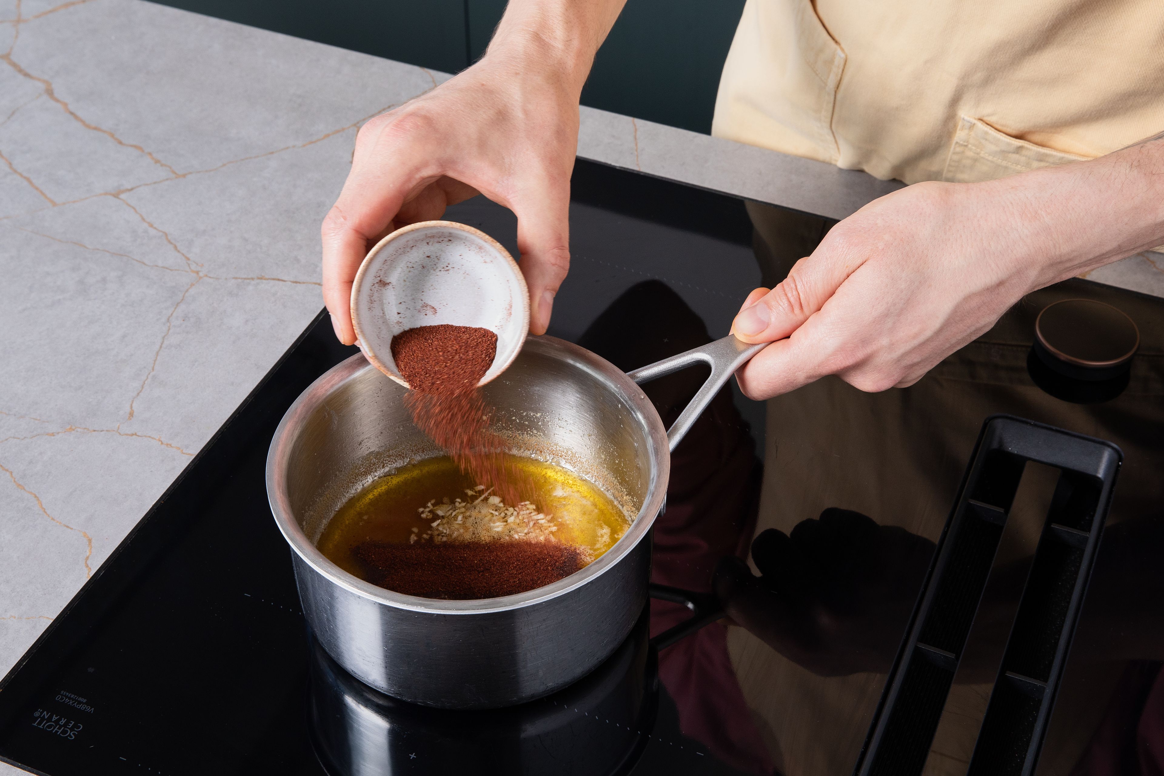 Peel and finely chop remaining garlic. Melt butter in a small saucepan over medium heat, stirring constantly, until it turns golden brown and smells nutty, for approx. 2–3 min. Remove from heat, stir in garlic, lemon zest, ground sumac, and a pinch of salt. Let steep for approx. 2 min.