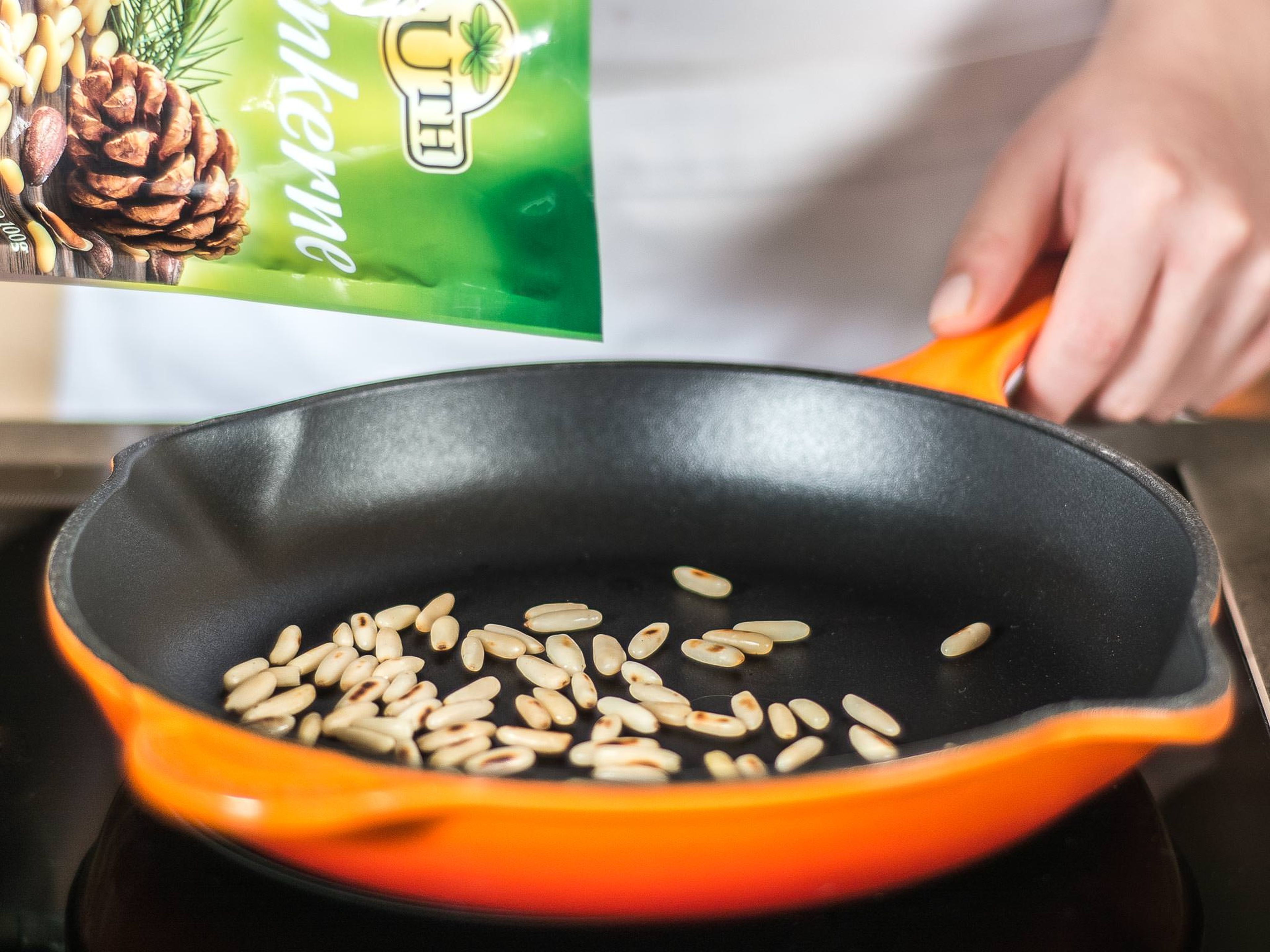 In a grease-free frying pan, toast pine nuts over medium-low heat, stirring often, for approx. 2 - 3 min. until golden brown and fragrant.