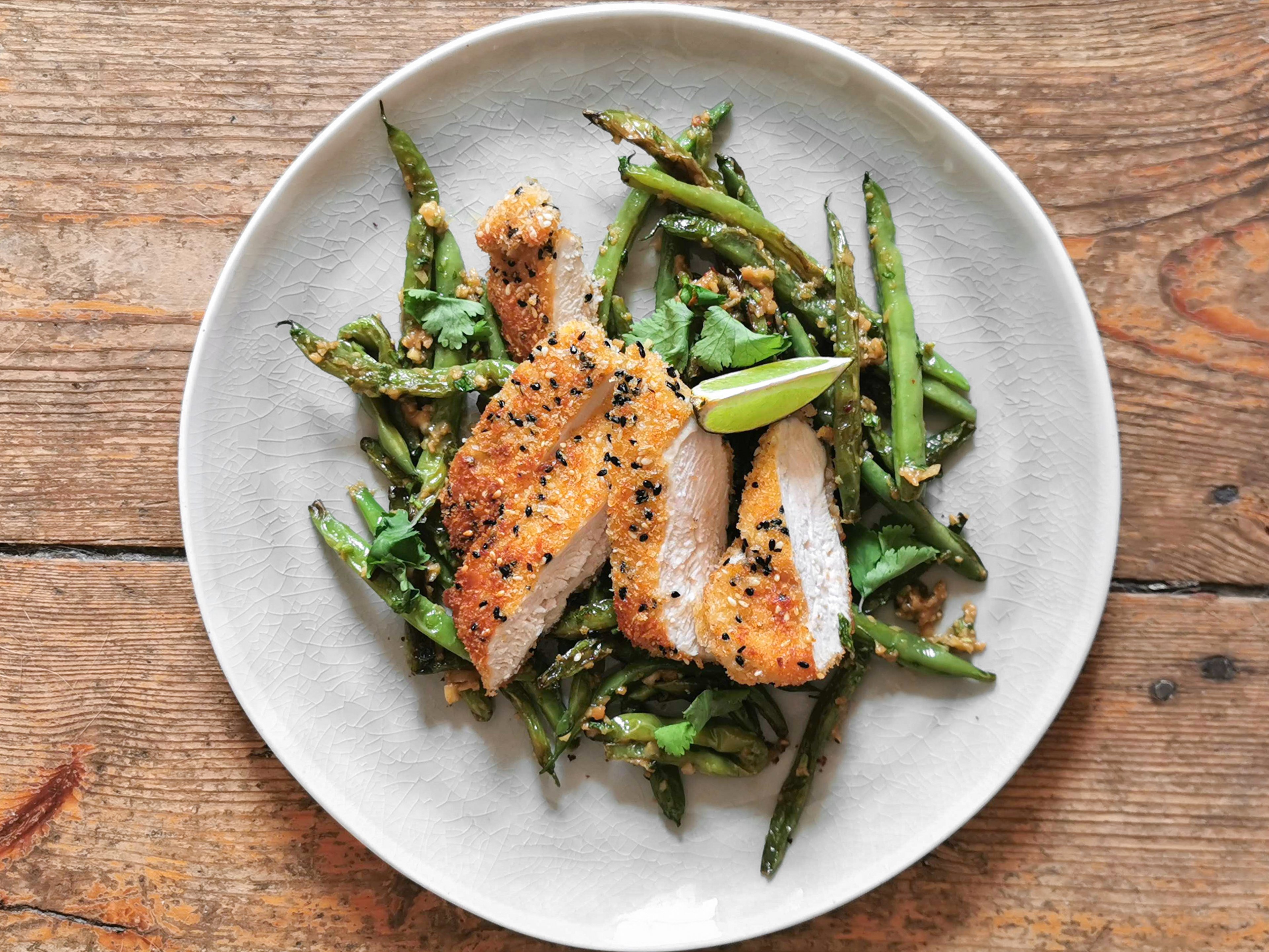 Seeded chicken schnitzel with green beans