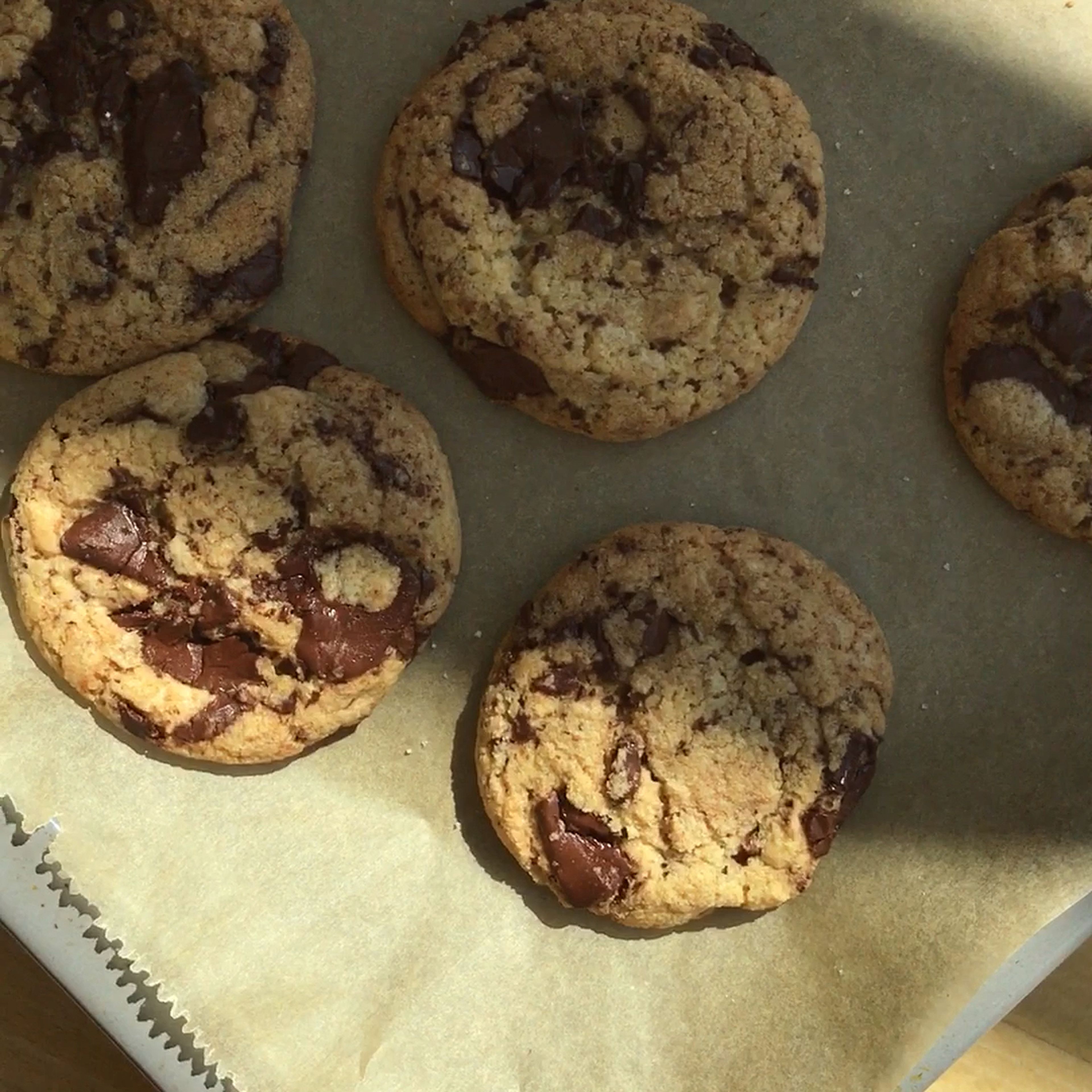 Start to bake the cookies for approx. 8 min., but you can go up to 12 min. depending on your oven. The edges should be golden brown while the center should look almost raw. If you feel like the cookies are under-baked, that's just the right moment to remove them from the oven. They will firm up outside of the oven and become wonderfully chewy. Let the cookies cool out completely to get them a tiny bit crispier, or store them between sheets of parchment in an airtight container while they are still lukewarm. Enjoy!