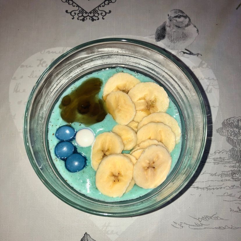 Blue oats with banana and caramel syrup