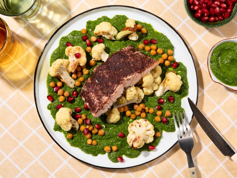 Baked salmon with cauliflower and chickpeas on chimichurri