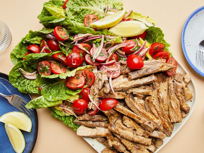 Grilled pork steak salad with tomatoes