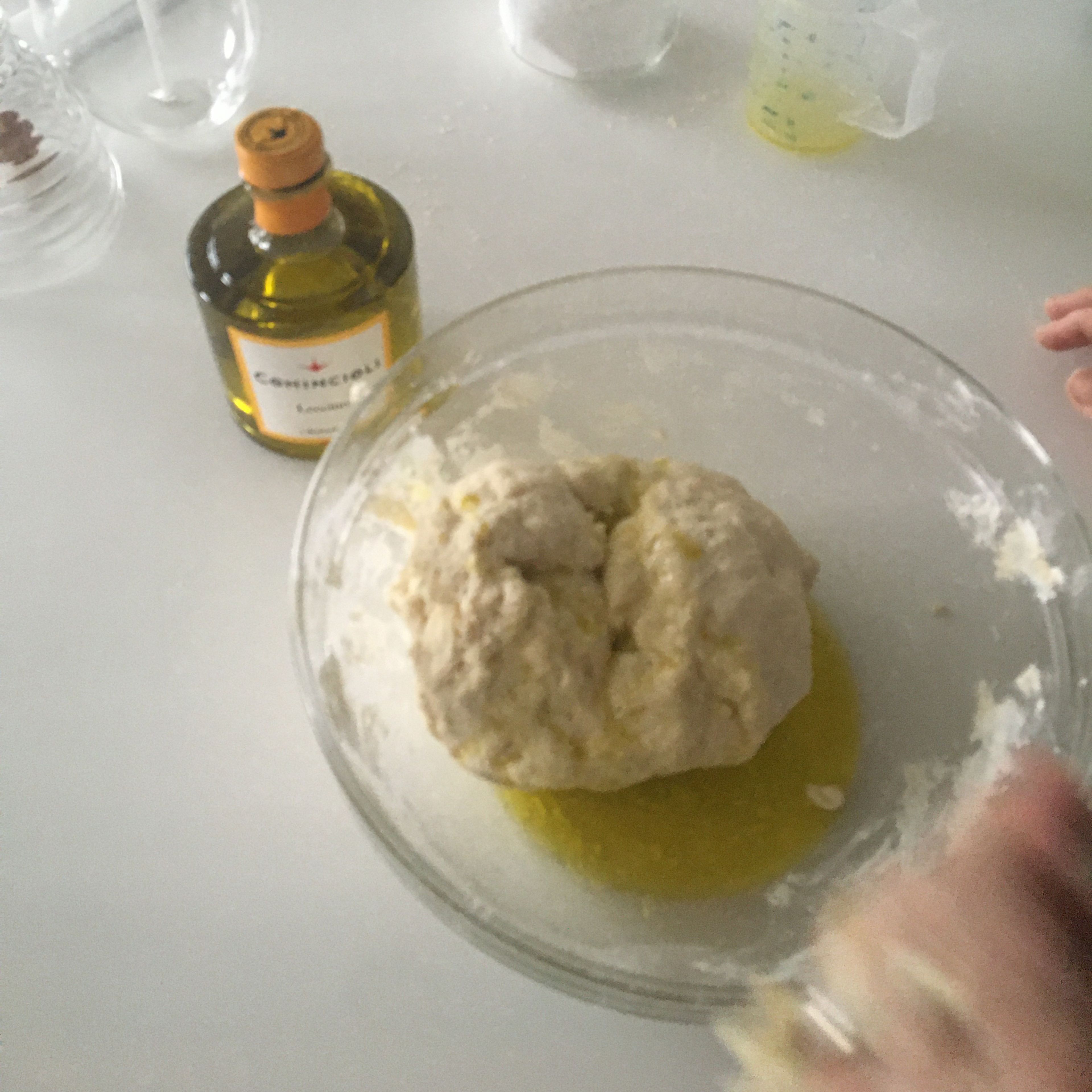 Put the dough back into the bowl and add your olive oil to the mixture